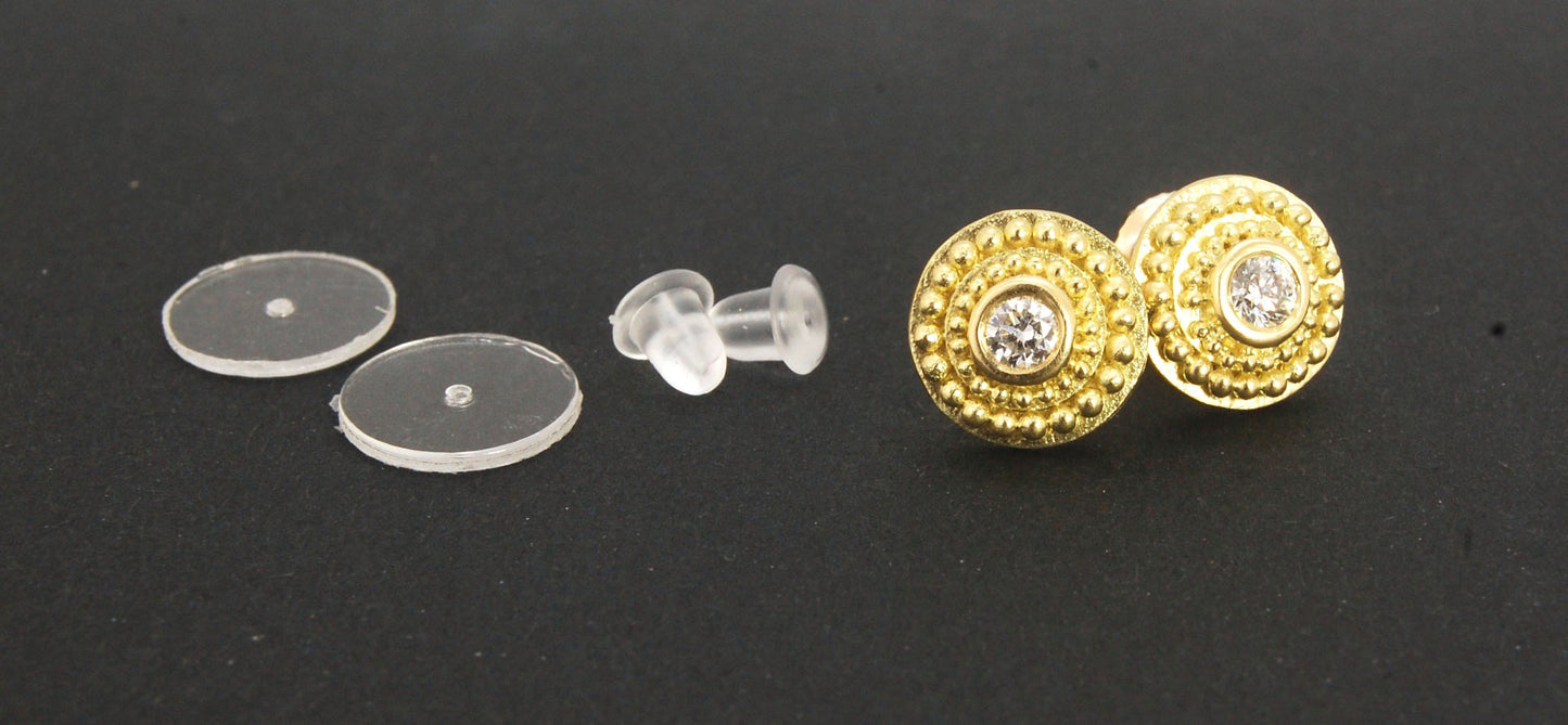 Diamond Disc Post Earrings - 18k Gold Granulation with 14k screw backs These Diamond Disc Stud Earrings are Classically-inspired 18k granulation. With 2 ethically-mined, .10ct , 3mm, Sl1, F+ round diamonds bezel-set in 18k a double ring of 18k gold granul