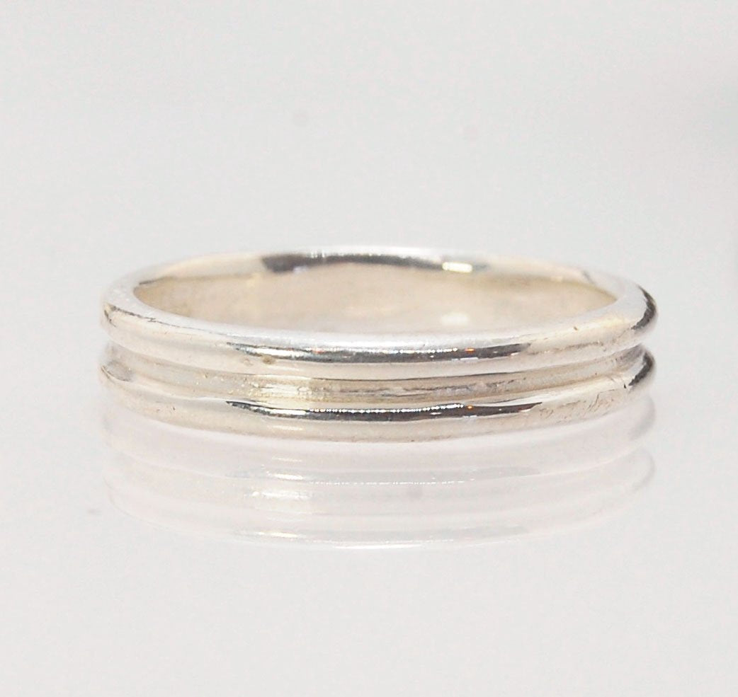 2 Rim 3.3mm Wide Band in Sterling silver Let me make a ring for you!This is a 2 rim band, 3.3 mm wide cast from a wax carving turned on a lathe and cast using the process of lost wax. These are so much fun to make and I have several variations of differen