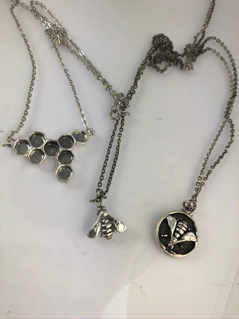 Bee Coin Necklace Carved in wax and cast using the lost-wax process in Sterling Silver, this bee coin was SO MUCH FUN to carve! I have made a mold and will be casting them to order. I inject the mold with wax and use that wax to cast using a lost-wax proc