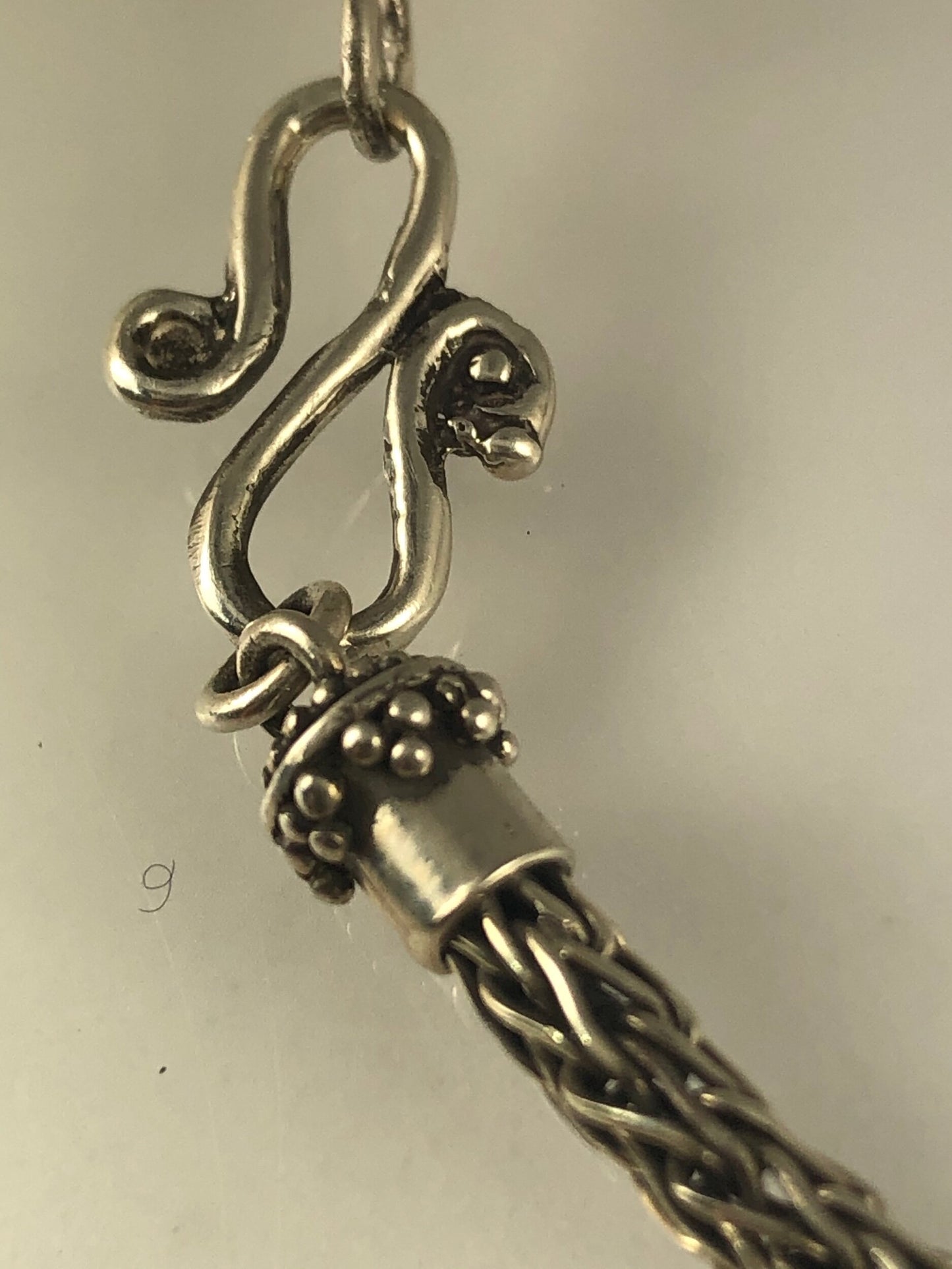 Viking Knit Woven Silver Bracelet with granulated caps and S clasp- cast,fine silver,fine silver granulation,Sterling Silver,woven chain These great woven bracelets are handwoven from fine silver with a cast granulated cap and S clasp. The original cap an