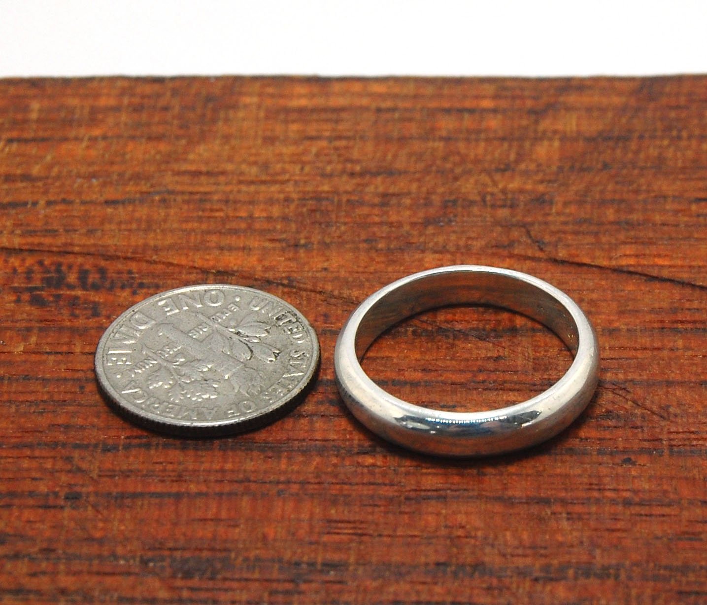 4mm Half Round Plain Band - 4mm wide x 1.8mm thick in Gold or Silver This half-round plain band is milled in my studio and hand-finished to your specifications. 4mm wide x 1.8 mm thick. This half-round band ring is pictured in sterling silver but can be c