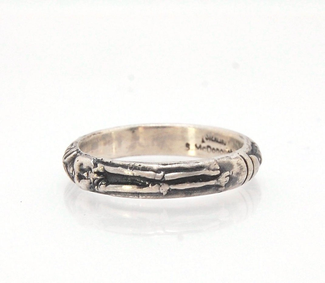 Oxidized Memento Mori Skeleton Ring - 4mm - Sterling Silver This is the middle width of my Memento Mori skeleton rings at 4mm wide. The Skeleton is flanked by crossed bones on one side and an hourglass on the other.Unlike my Enameled Memento Mori Rings, t