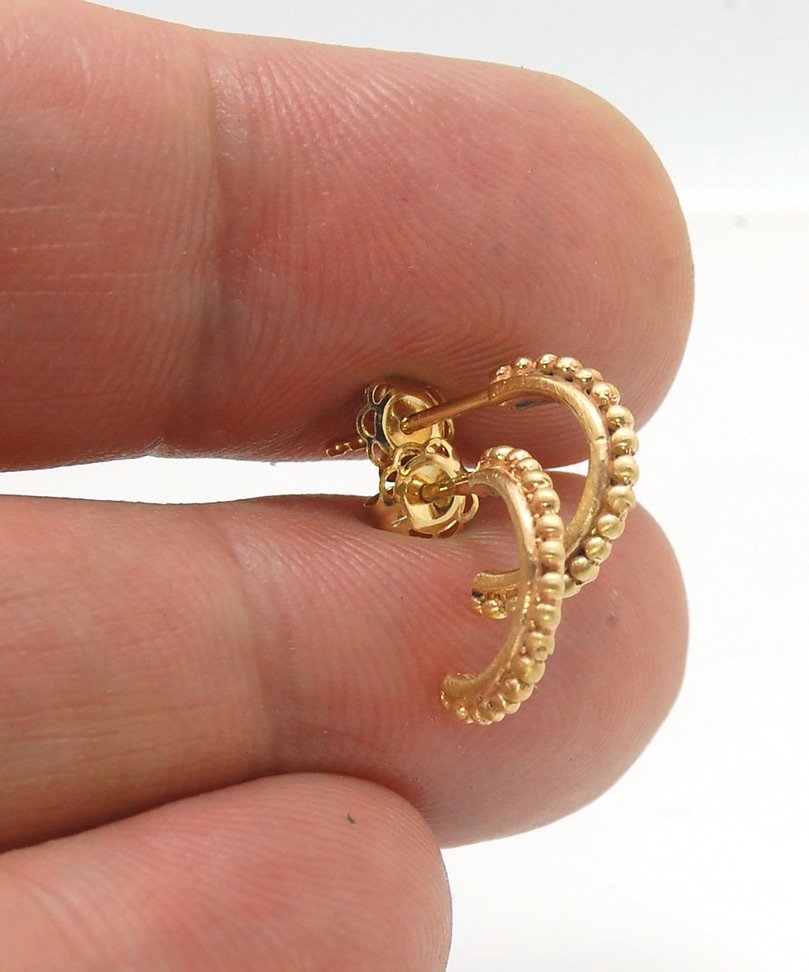 Etruscan Hoop Posts - Extra Small Huggies in 14k gold These are my smallest Etruscan Hoops as a post earring! Smaller than a dime - these post hoops hug your earlobe. So freakin’ cute! I like to wear them in my second piercing up and I prefer the gold! Bu