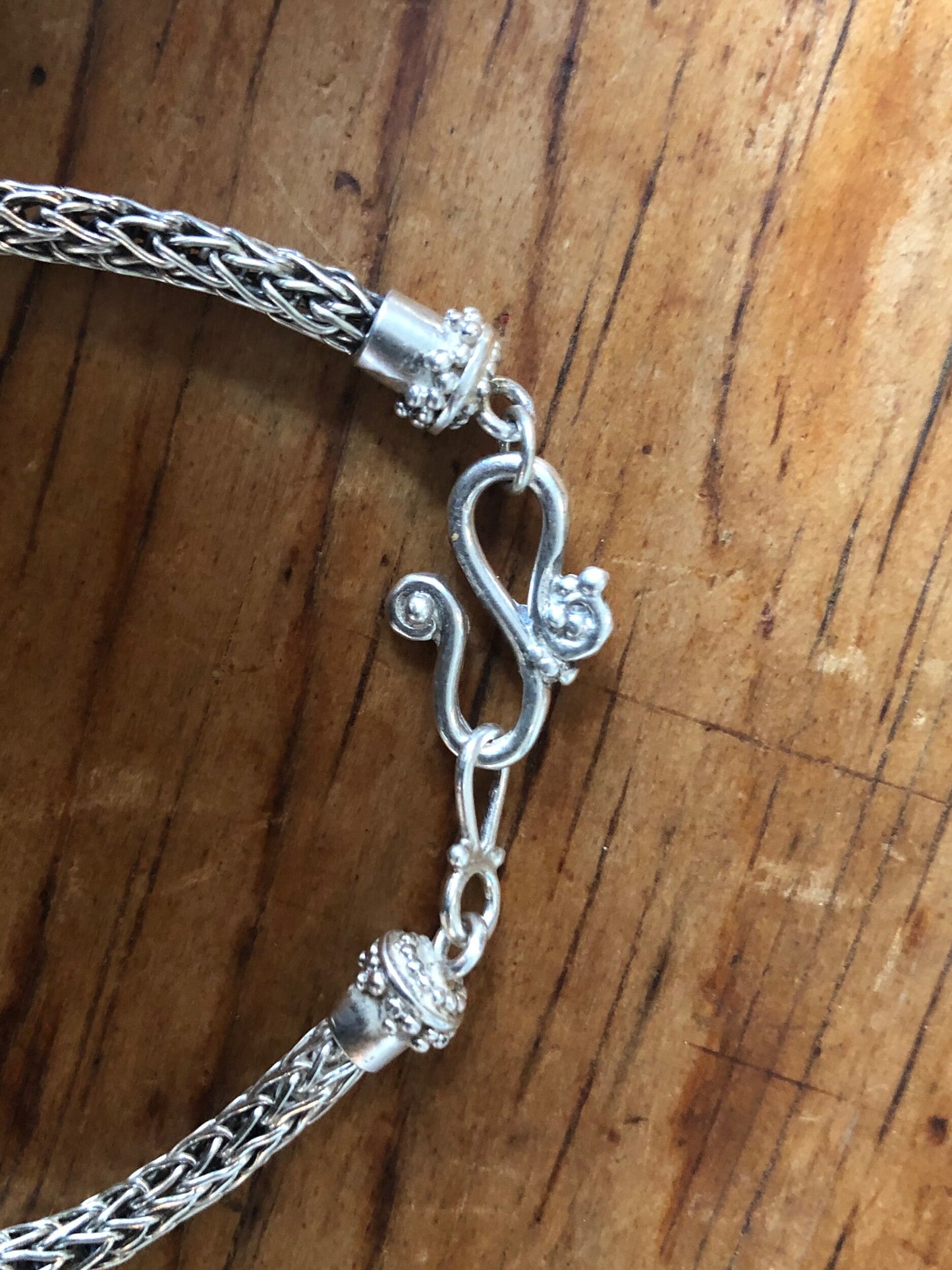 Viking Knit Woven Silver Bracelet with granulated caps and S clasp- cast,fine silver,fine silver granulation,Sterling Silver,woven chain These great woven bracelets are handwoven from fine silver with a cast granulated cap and S clasp. The original cap an