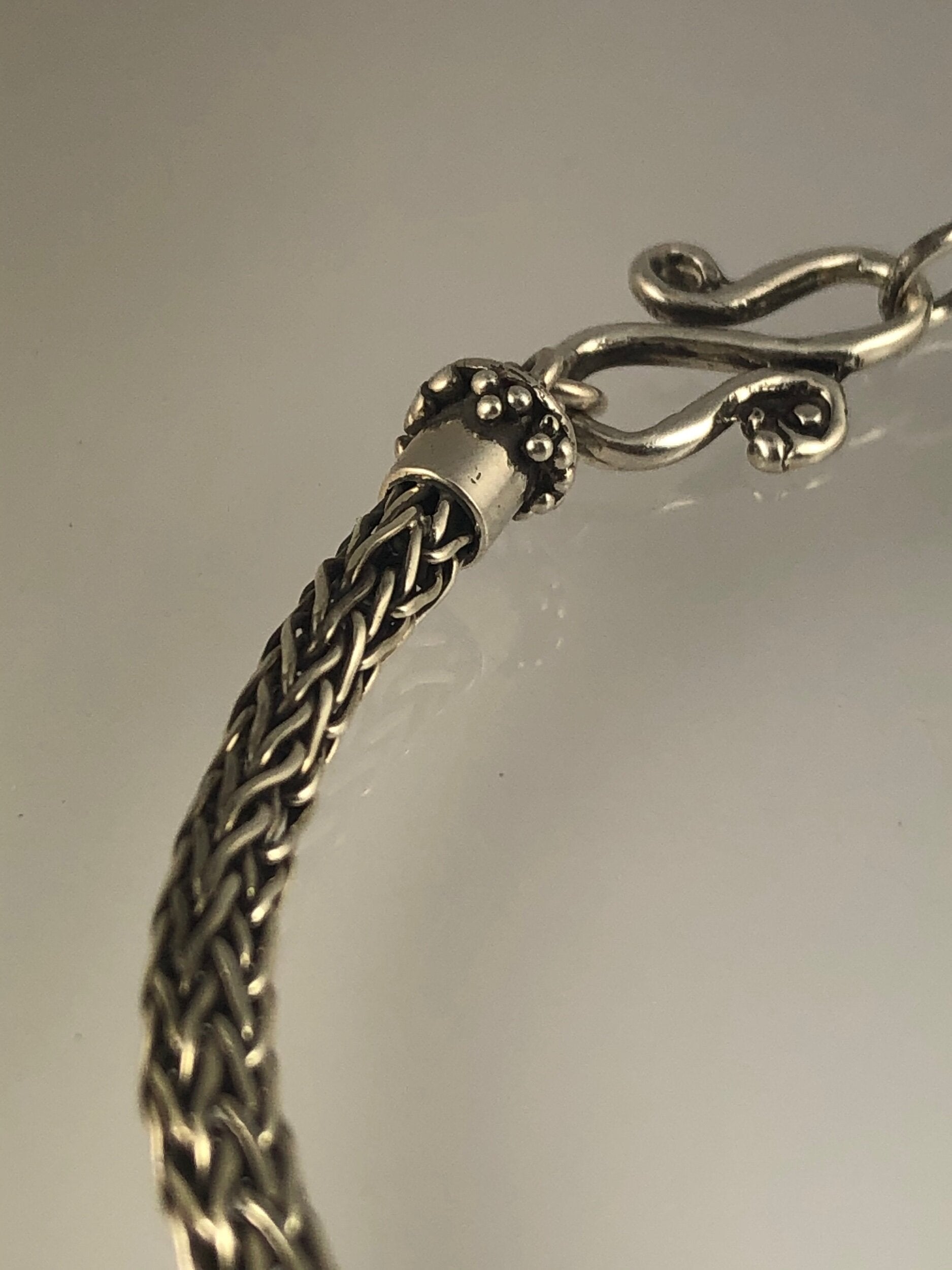 Viking Knit Woven Silver Bracelet with granulated caps and S clasp- cast,fine silver,fine silver granulation,Sterling Silver,woven chain These great woven bracelets are handwoven from fine silver with a cast granulated cap and S clasp. The original cap an