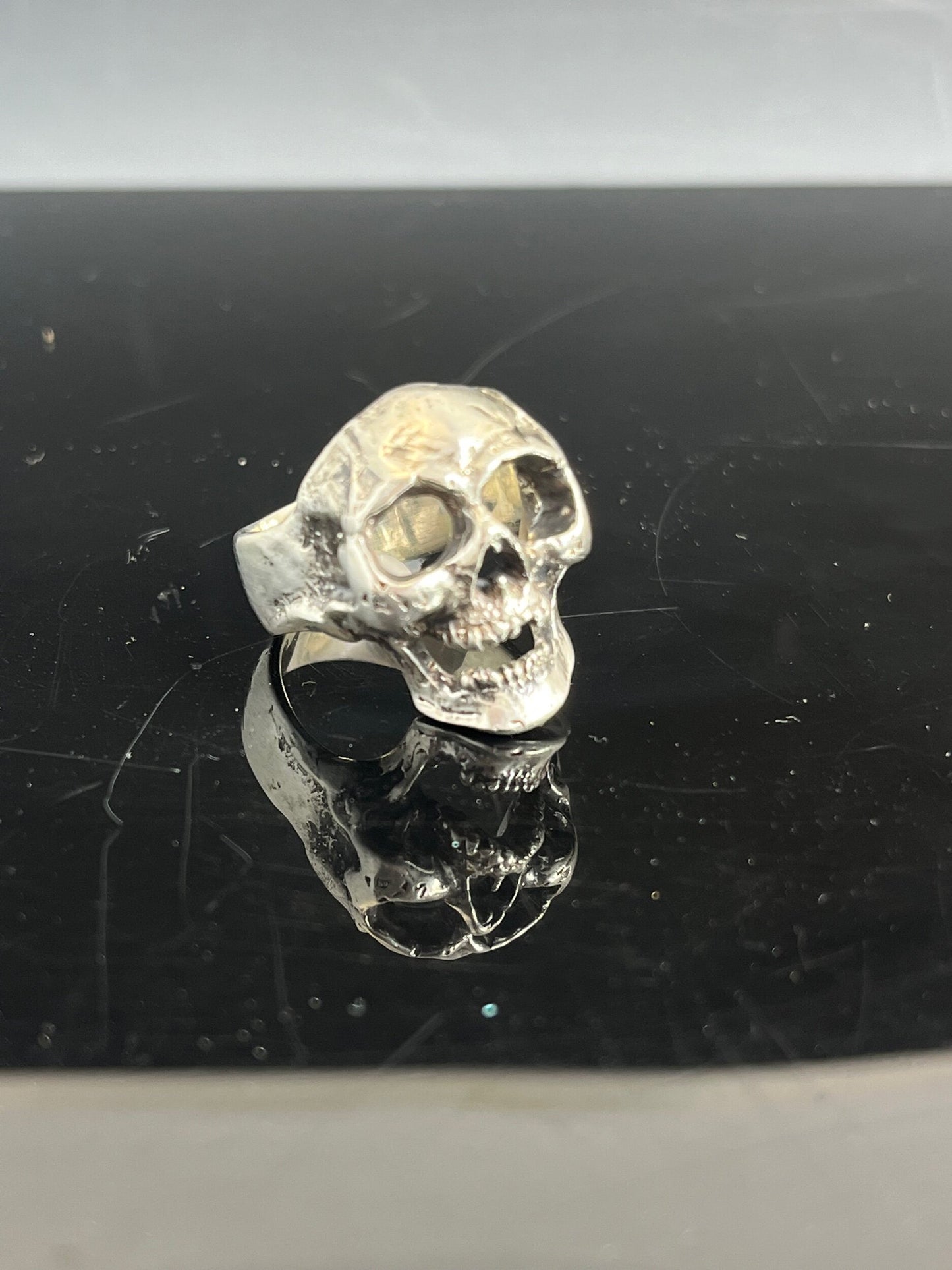 Screaming into the Void Skull Ring This is a lightweight but sizable skull ring that is Made to Order for you in your size. I carved this skull in wax, hollowed out the inside of the skull and cast it using the lost wax casting method. This Screaming into