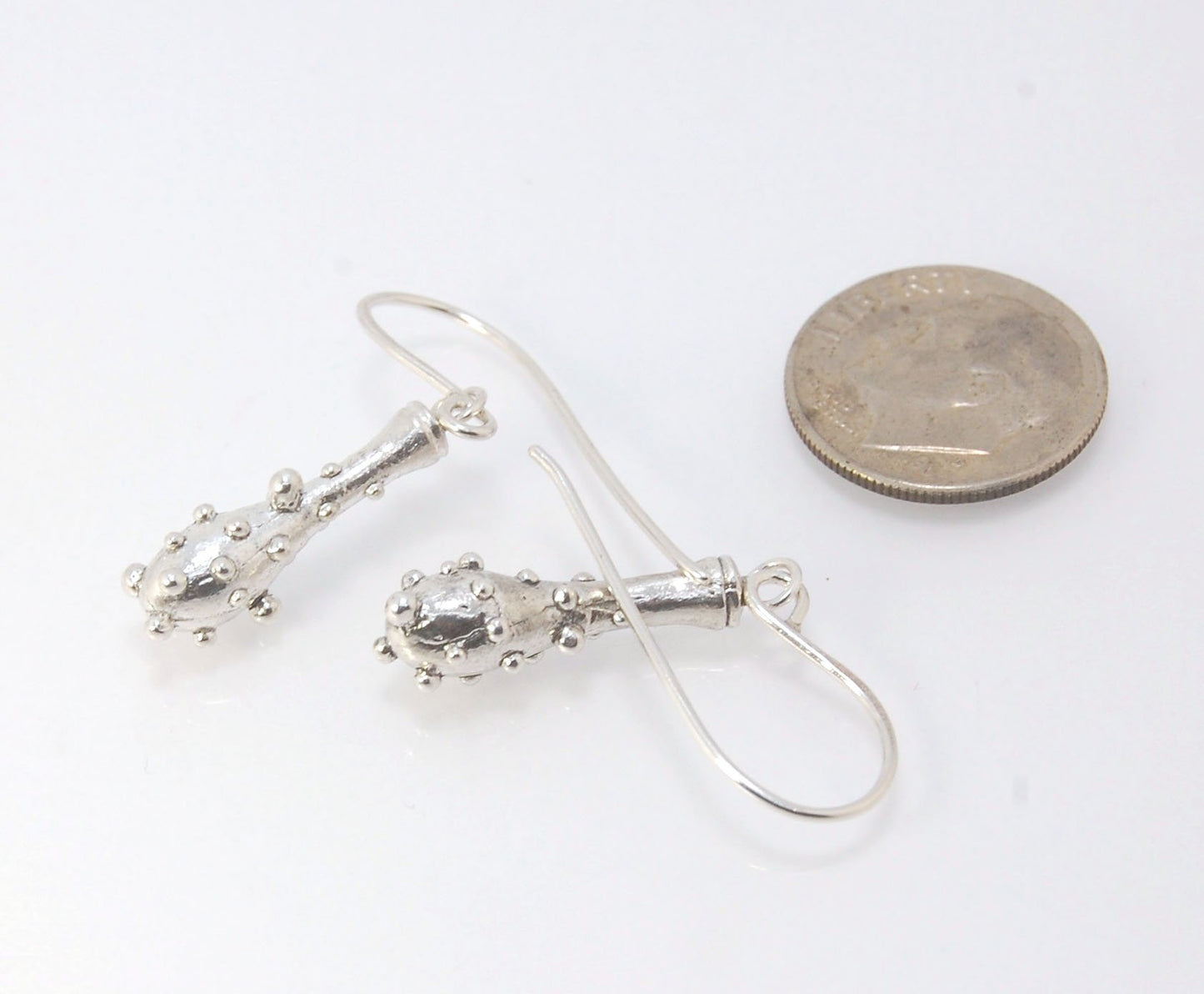 Bubble Club Dangle Earrings in Sterling These fun dangle earrings started as an experiment in wax that I ended up just LOVING!Here they are in Sterling after being cast using the ancient lost wax process. I then made a mold so I can make as many as I want