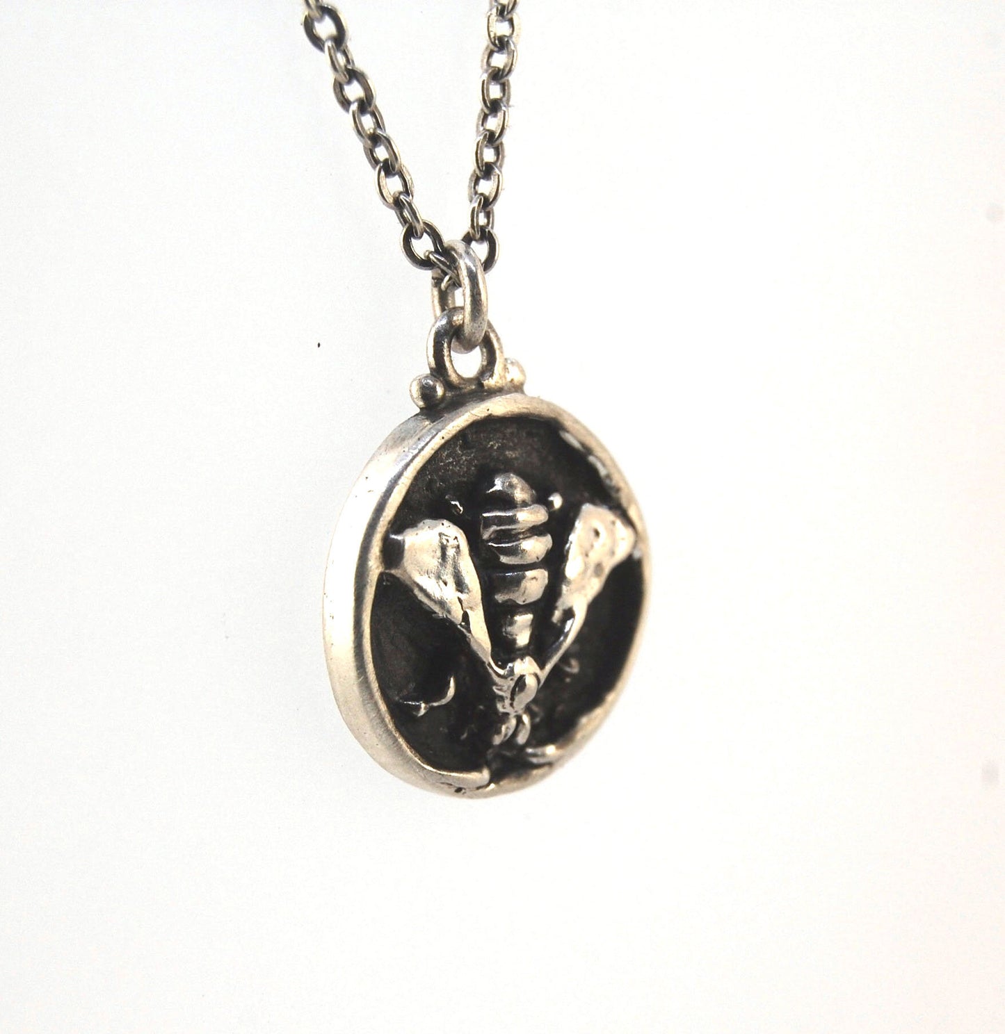 Bee Coin Necklace Carved in wax and cast using the lost-wax process in Sterling Silver, this bee coin was SO MUCH FUN to carve! I have made a mold and will be casting them to order. I inject the mold with wax and use that wax to cast using a lost-wax proc
