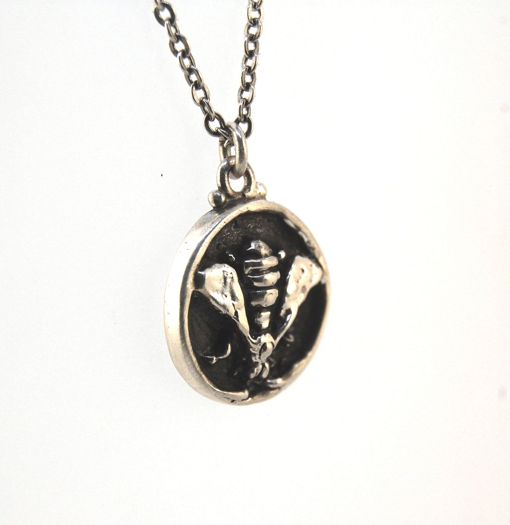Bee Coin Necklace Carved in wax and cast using the lost-wax process in Sterling Silver, this bee coin was SO MUCH FUN to carve! I have made a mold and will be casting them to order. I inject the mold with wax and use that wax to cast using a lost-wax proc