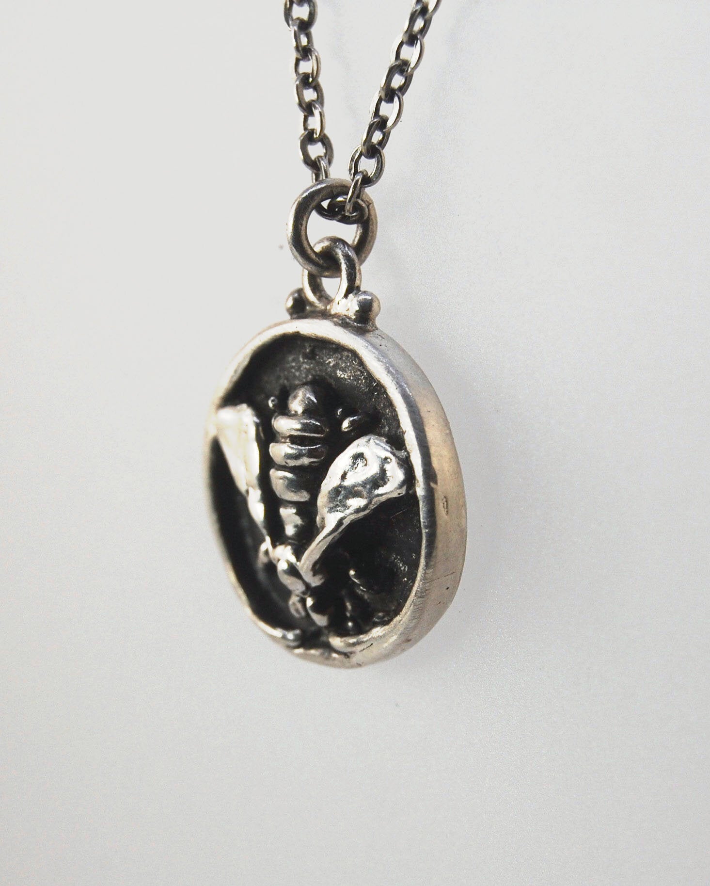 Bee Coin Necklace Carved in wax and cast using the lost-wax process in Sterling Silver, this bee coin was SO MUCH FUN to carve! I have made a mold and will be casting them to order. I inject the mold with wax and use that wax to cast using a lost-wax proc