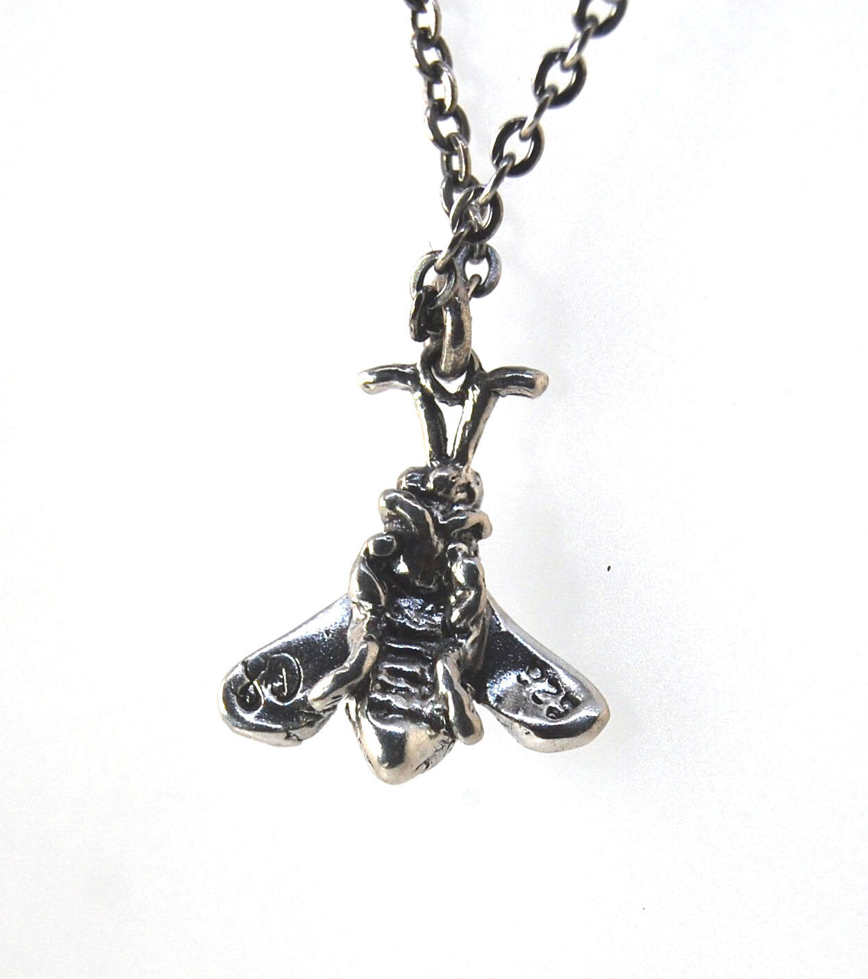Bee Necklace in Sterling Silver Bee Necklace in Sterling Silver with a Sterling Chain and clasp.These bees were so fun to carve!Carved in wax and cast using a lost-wax process in Sterling Silver. I have made a mold of the first bee so I can make more bees