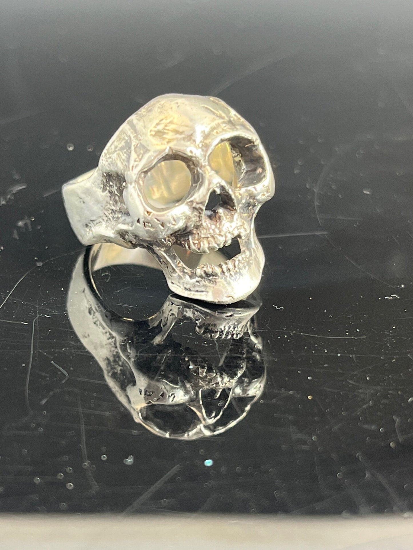 Screaming into the Void Skull Ring This is a lightweight but sizable skull ring that is Made to Order for you in your size. I carved this skull in wax, hollowed out the inside of the skull and cast it using the lost wax casting method. This Screaming into