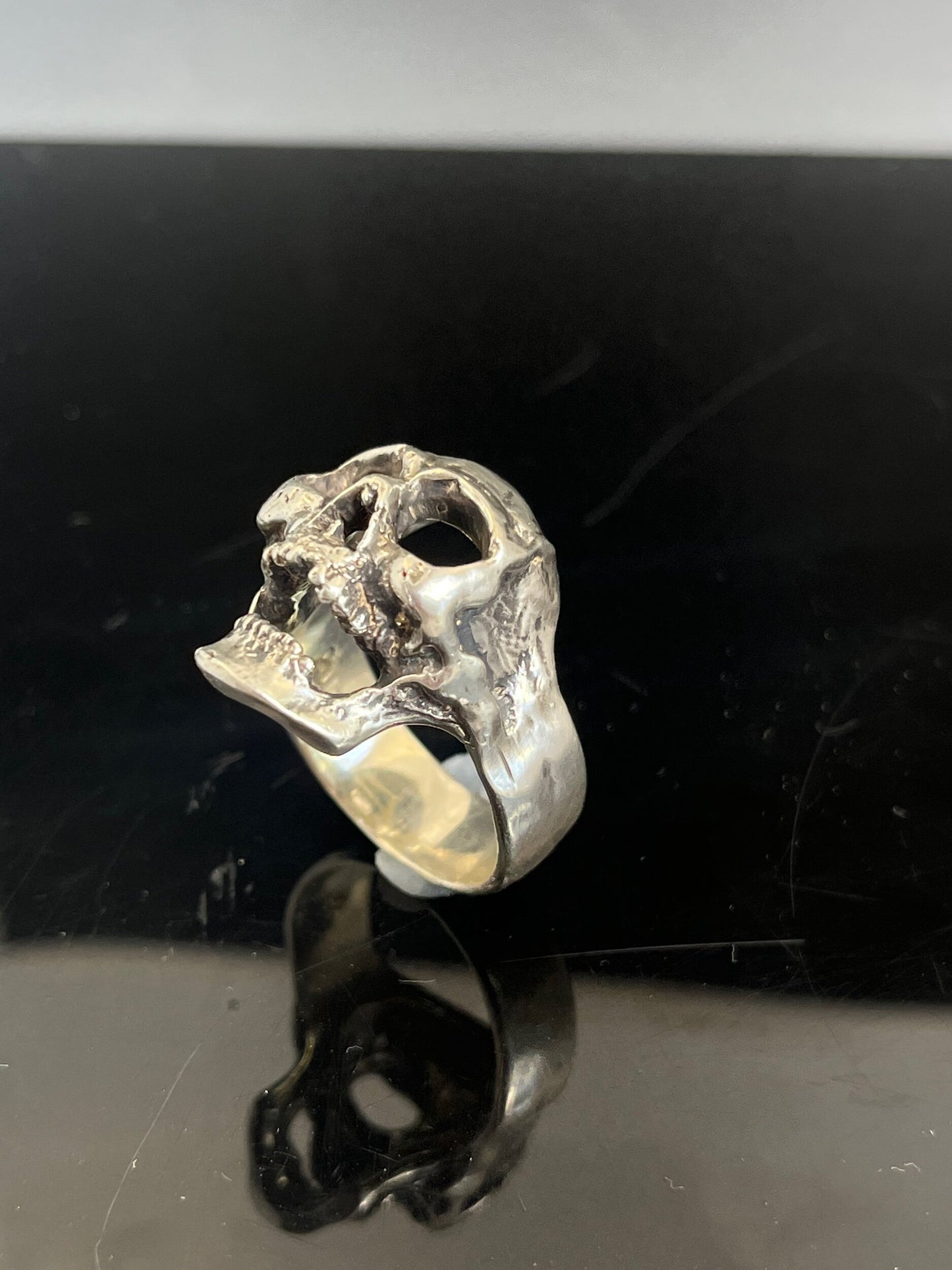 Screaming into the Void Skull Ring This is a lightweight but sizable skull ring that is Made to Order for you in your size. I carved this skull in wax, hollowed out the inside of the skull and cast it using the lost wax casting method. This Screaming into