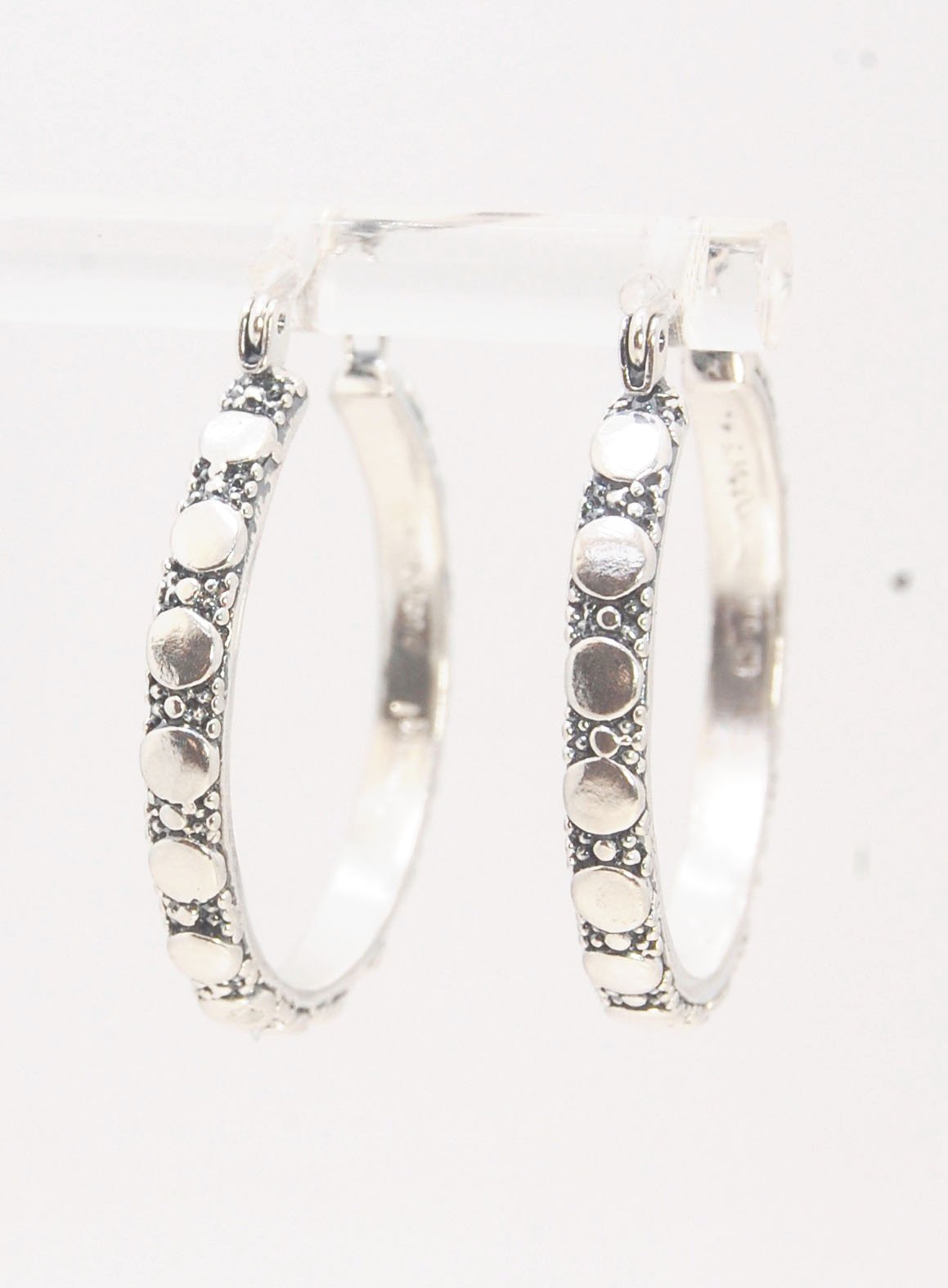 Disc Hoops - Sterling in 3 sizes These Hoops are made from a Disc pattern with heavy granules and ingot slices and have a hoop catch with a satisfying snap and come in three sizes:Large - 4mm wide and 1.25” in diameterMedium - 4mm wide and .75” in diamete