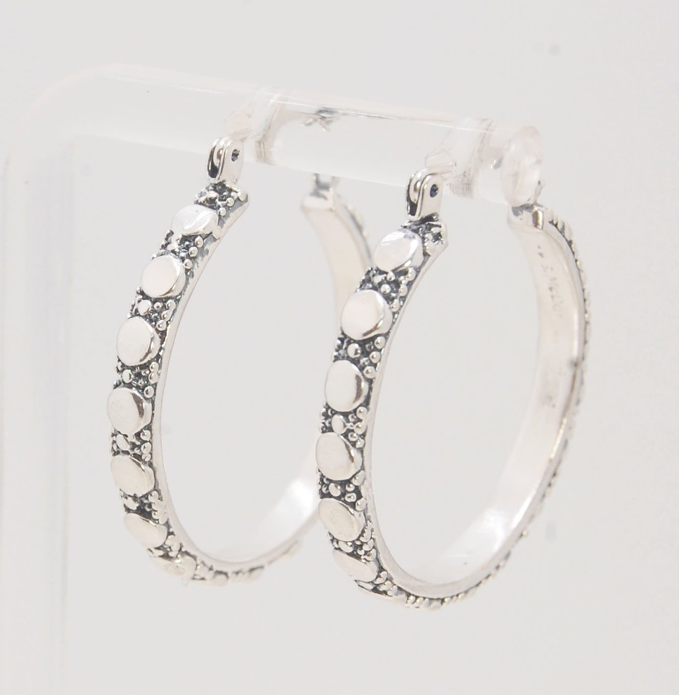 Disc Hoops - Sterling in 3 sizes These Hoops are made from a Disc pattern with heavy granules and ingot slices and have a hoop catch with a satisfying snap and come in three sizes:Large - 4mm wide and 1.25” in diameterMedium - 4mm wide and .75” in diamete