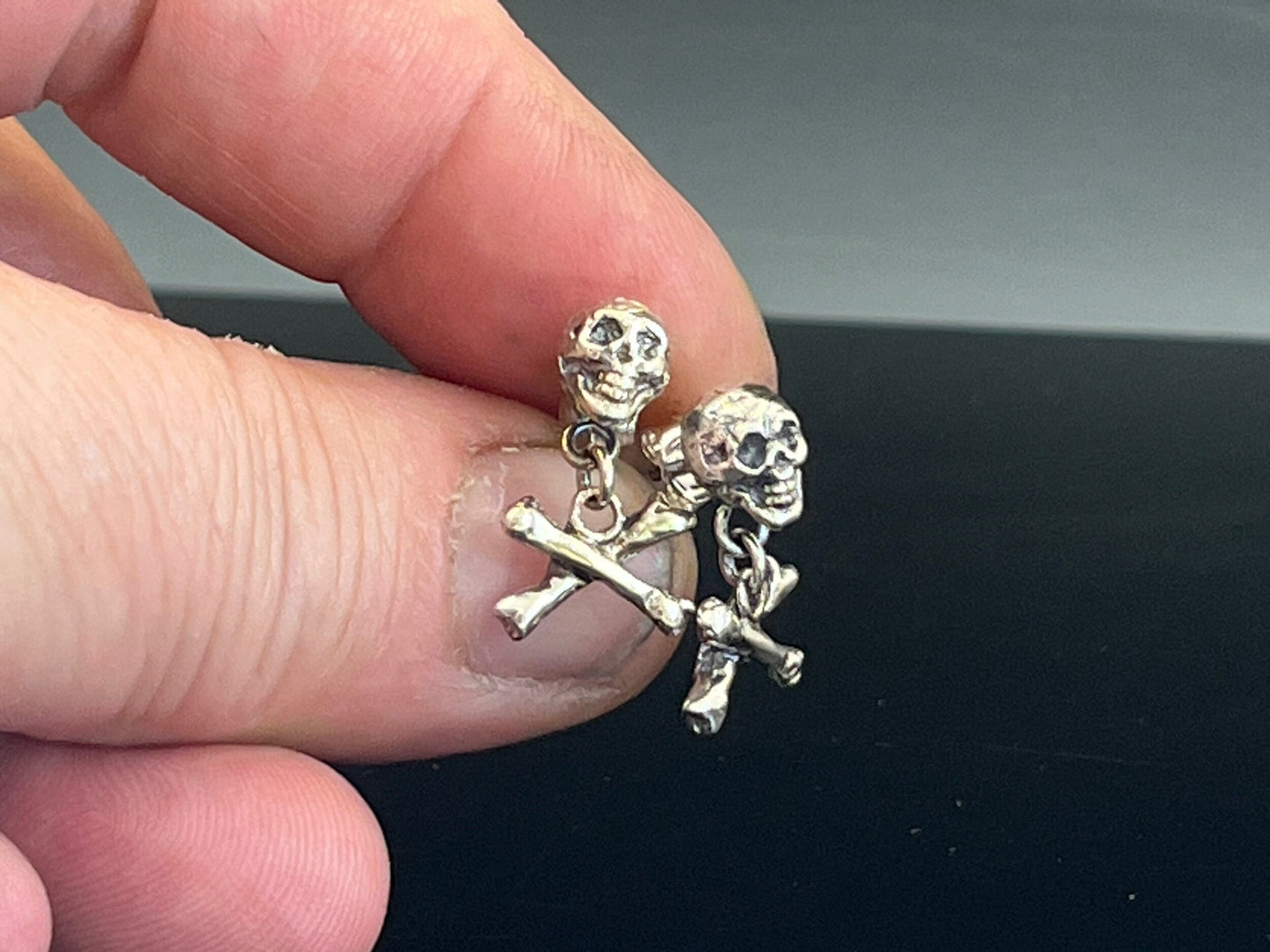 Skull & Bones Dangle Post Earrings These solid sterling silver Skull & Bones dangle earrings are wax carved by hand and cast using the ancient process of Lost Wax to cast them in sterling silver. I then made a mold, which I can inject with wax and make wa