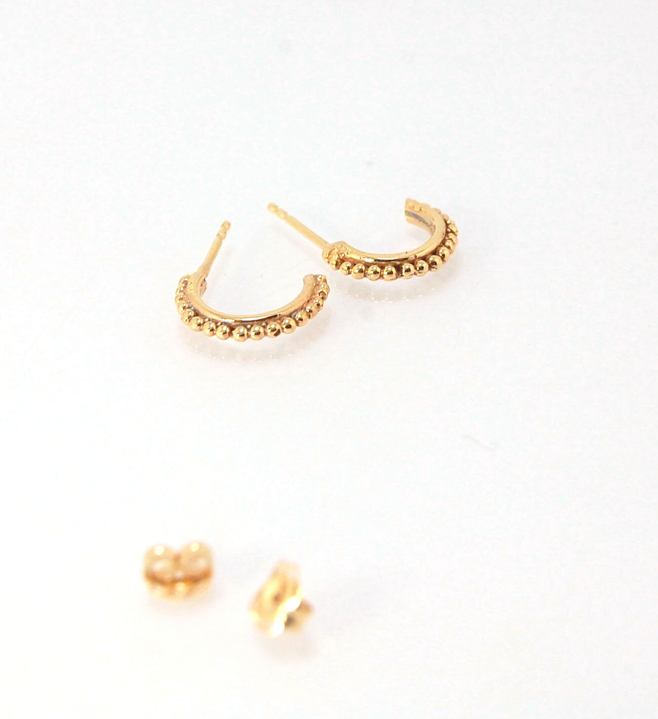 Etruscan Hoop Posts - Xtra Small in Sterling Silver These are my smallest Etruscan Hoops as a post-earring! Smaller than a dime - these post hoops hug your earlobe. So freakin’ cute! I like to wear them in my second piercing up and I prefer the gold! But