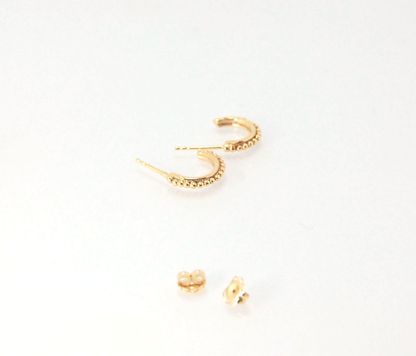 Etruscan Hoop Posts - Xtra Small in Sterling Silver These are my smallest Etruscan Hoops as a post-earring! Smaller than a dime - these post hoops hug your earlobe. So freakin’ cute! I like to wear them in my second piercing up and I prefer the gold! But