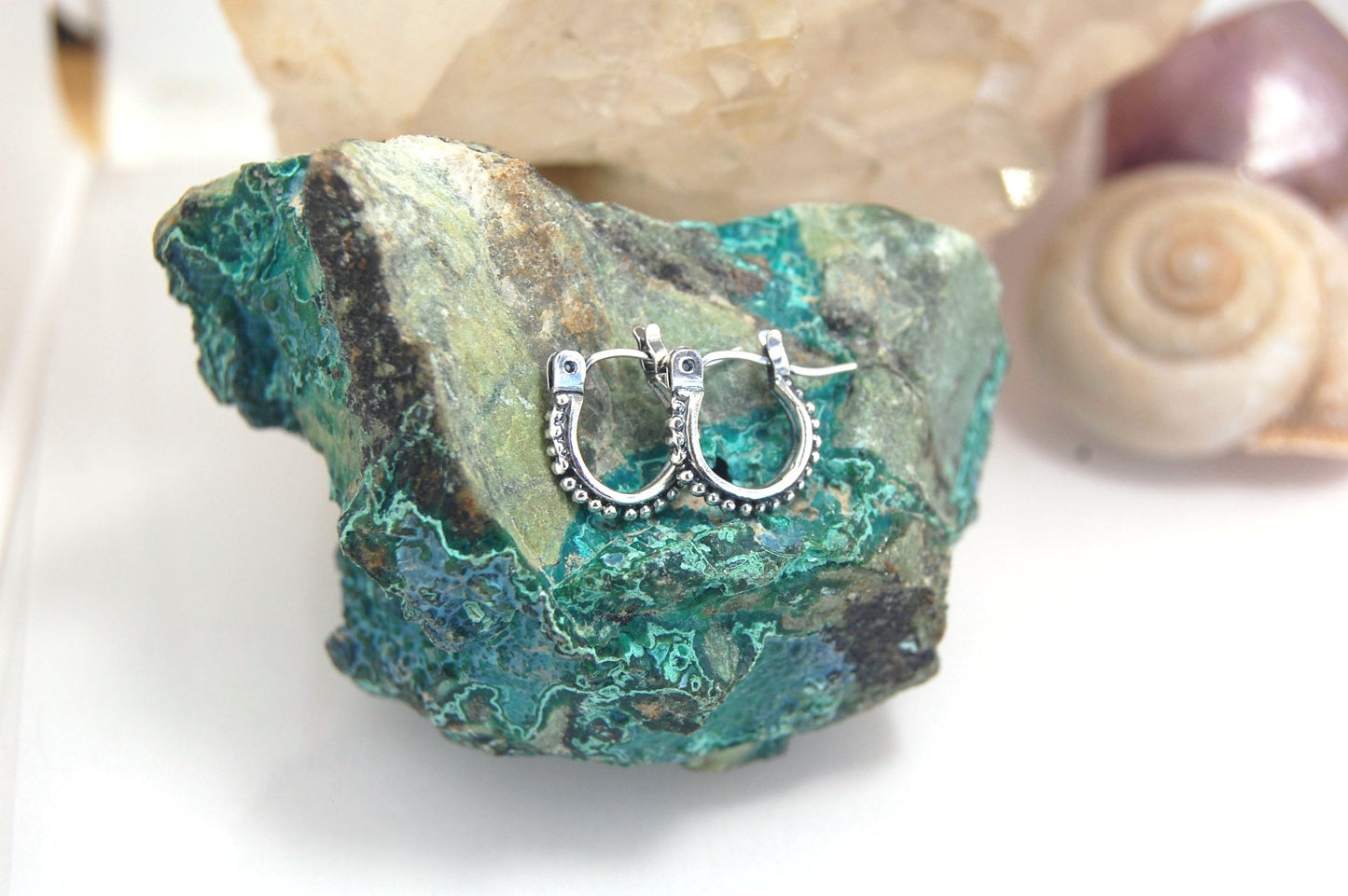 Etruscan hoops in Sterling Silver - xtraSmall Huggies These xtra small huggie hoops in sterling silver hoops are cast from a granulated master for a limited edition series of hoops and graze the bottom of your earlobe. I use fine silver for the original g
