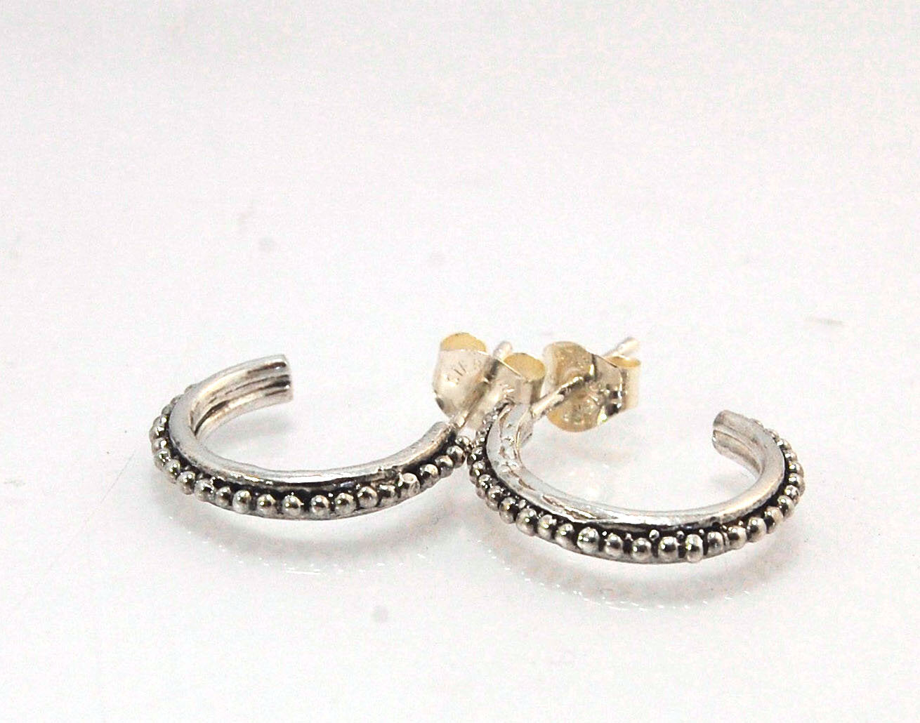 Etruscan Hoop Posts - Medium - Sterling Silver These are my Medium sized Etruscan Hoops as a post-earring!These sterling silver hoop posts are cast using the Lost Wax process from a granulated master for a limited edition series of hoops. I use fine silve