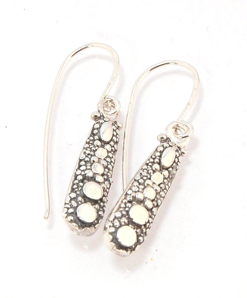 'Gator Pattern Silver Earrings with French Hooks These great 'Gator pattern earrings have terrific movement and shine! These are cast versions of the original granulation work, which is then molded for repeat waxes and then cast in my studio. These squigg