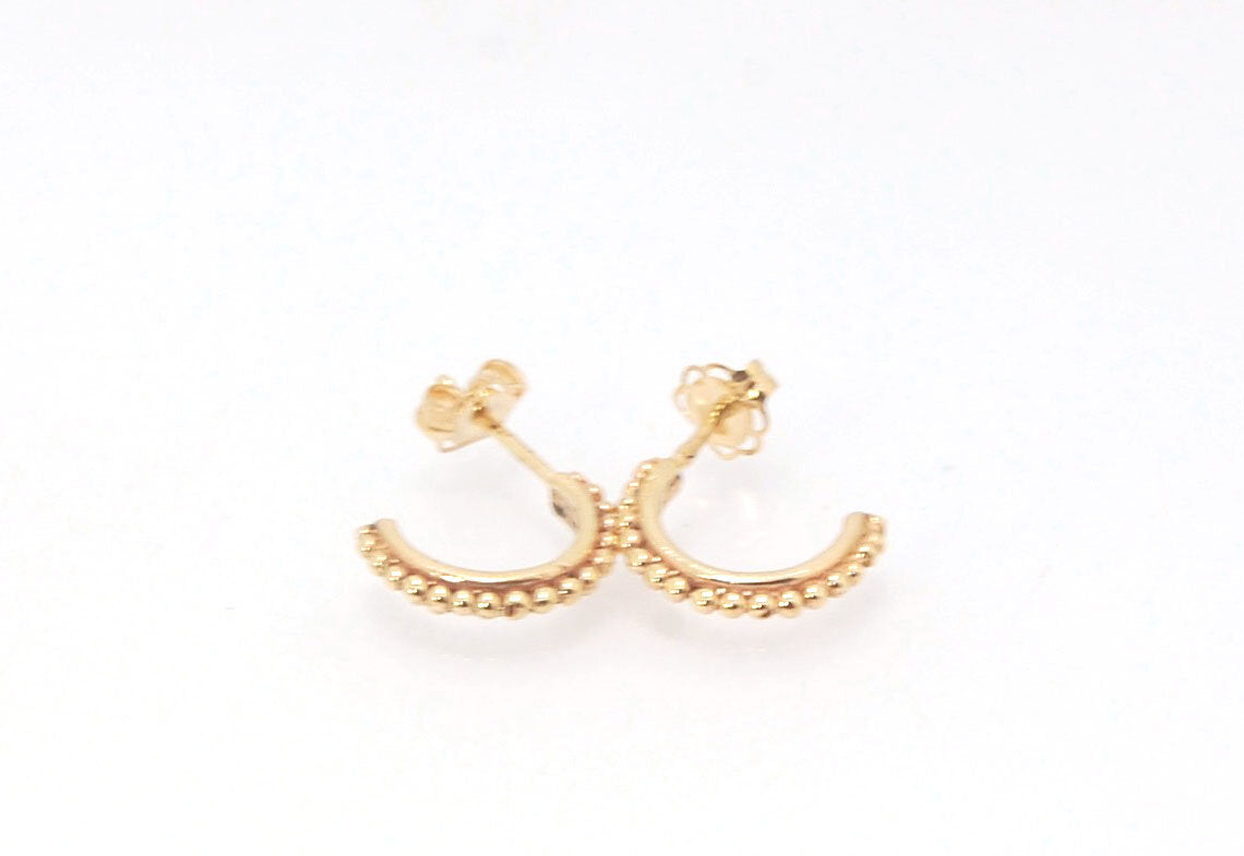 Etruscan Hoop Posts - Extra Small Huggies in 14k gold These are my smallest Etruscan Hoops as a post earring! Smaller than a dime - these post hoops hug your earlobe. So freakin’ cute! I like to wear them in my second piercing up and I prefer the gold! Bu