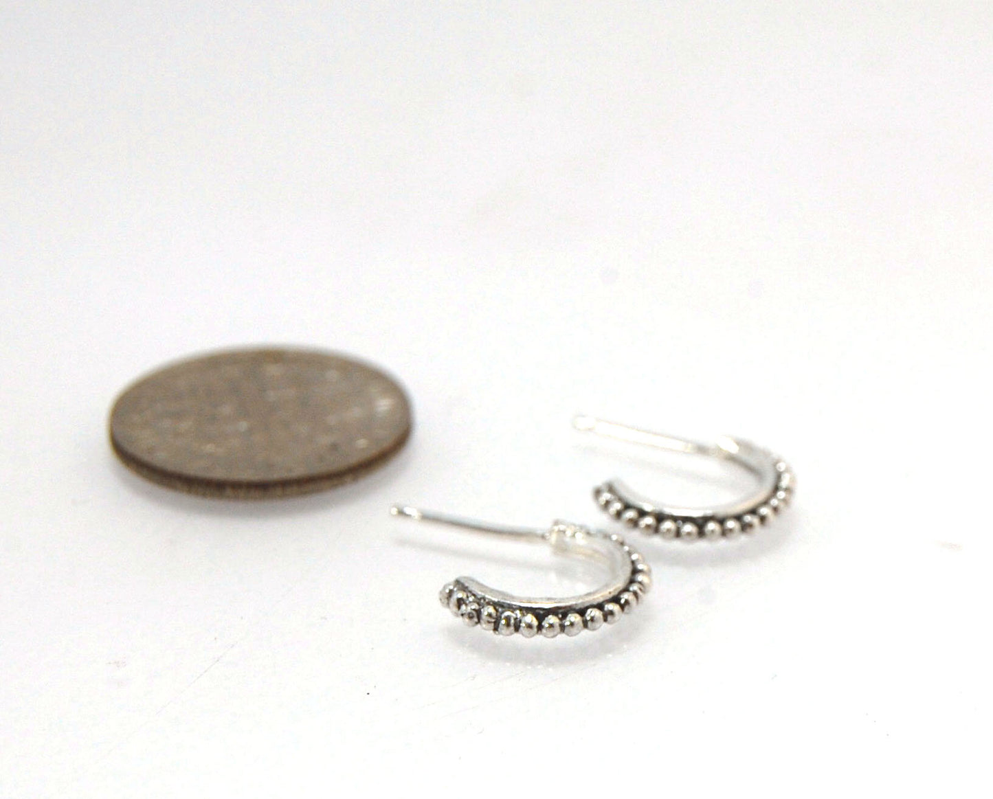 Etruscan Hoop Posts - Xtra Small in Sterling Silver These are my smallest Etruscan Hoops as a post-earring! Smaller than a dime - these post hoops hug your earlobe. So freakin’ cute! I like to wear them in my second piercing up and I prefer the gold! But