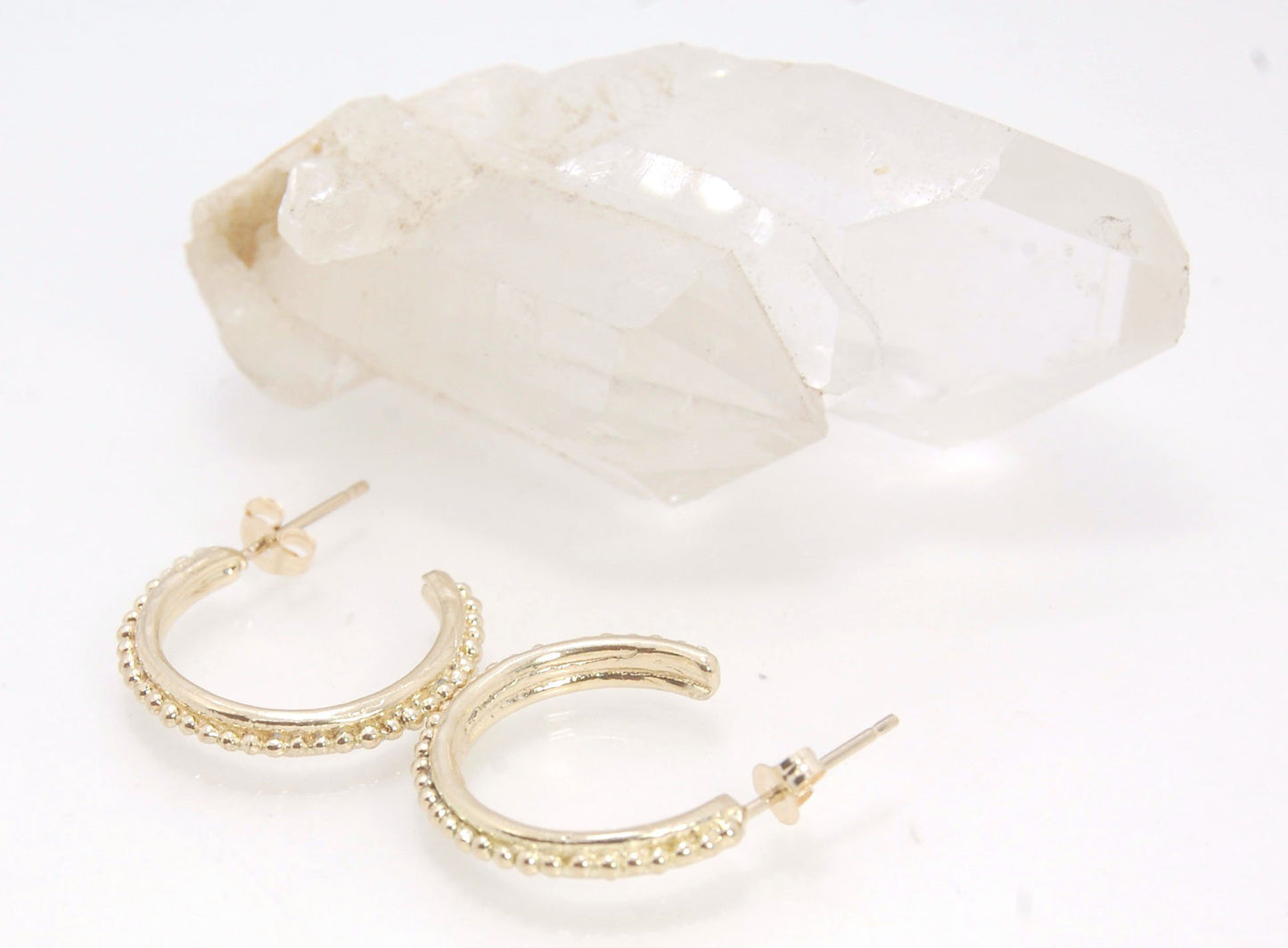 Etruscan hoop posts in 14k Gold - Medium-SQ5258500 These 14k yellow gold hoops are cast in my studio from a granulated master for a limited edition series of hoops. I use fine silver for the original granulation, then make a mold, pull a wax copy from the