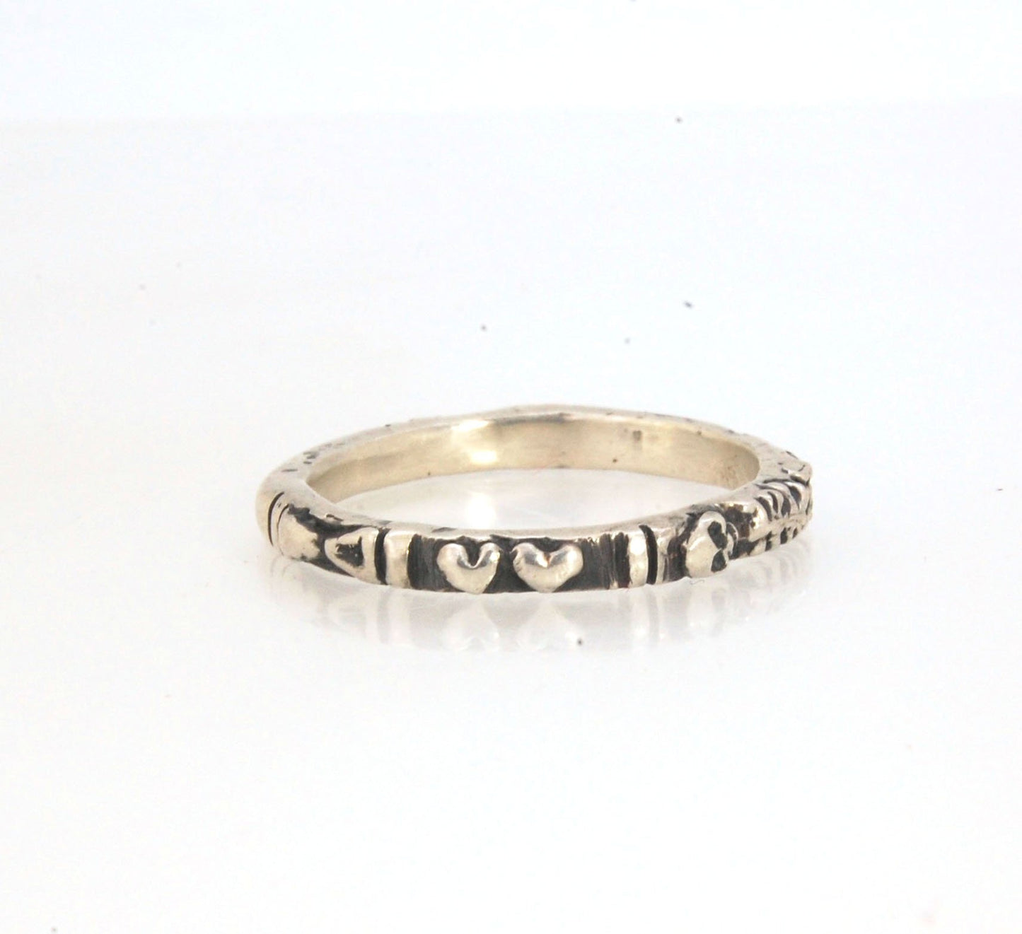 Oxidized Memento Mori Skeleton Ring - 2.7mm - Sterling Silver This is the most narrow of my Memento Mori Skeleton rings at 2.7mm wide! The Skeleton is flanked by crossed bones on one side and intertwined hearts and an hourglass on the other. This is the 4