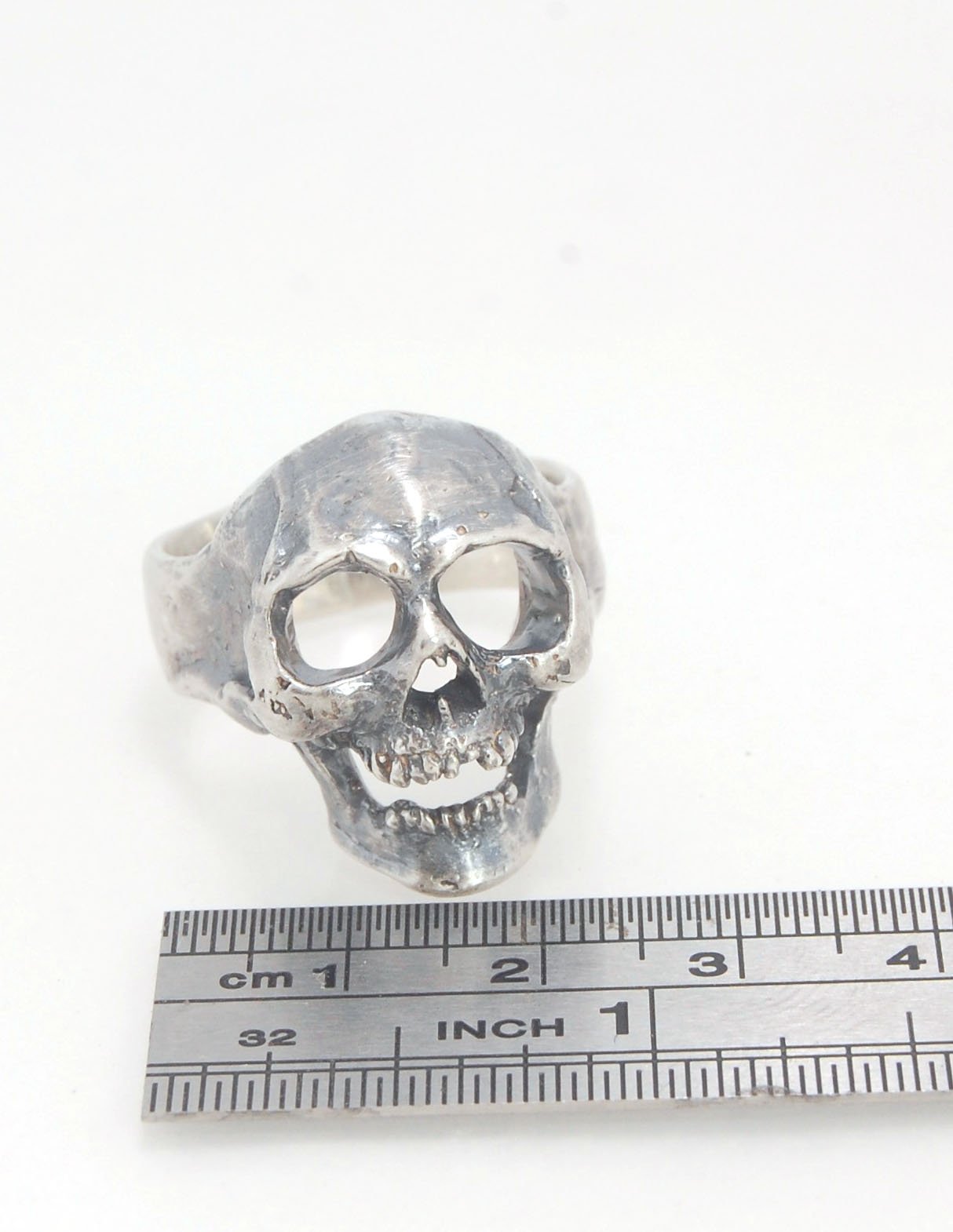 Screaming into the Void Skull Ring This is a lightweight but sizable skull ring that is Made to Order for you in your size. I carved this skull in wax, hollowed out the inside of the skull and cast it using the lost wax casting method. This Screaming into