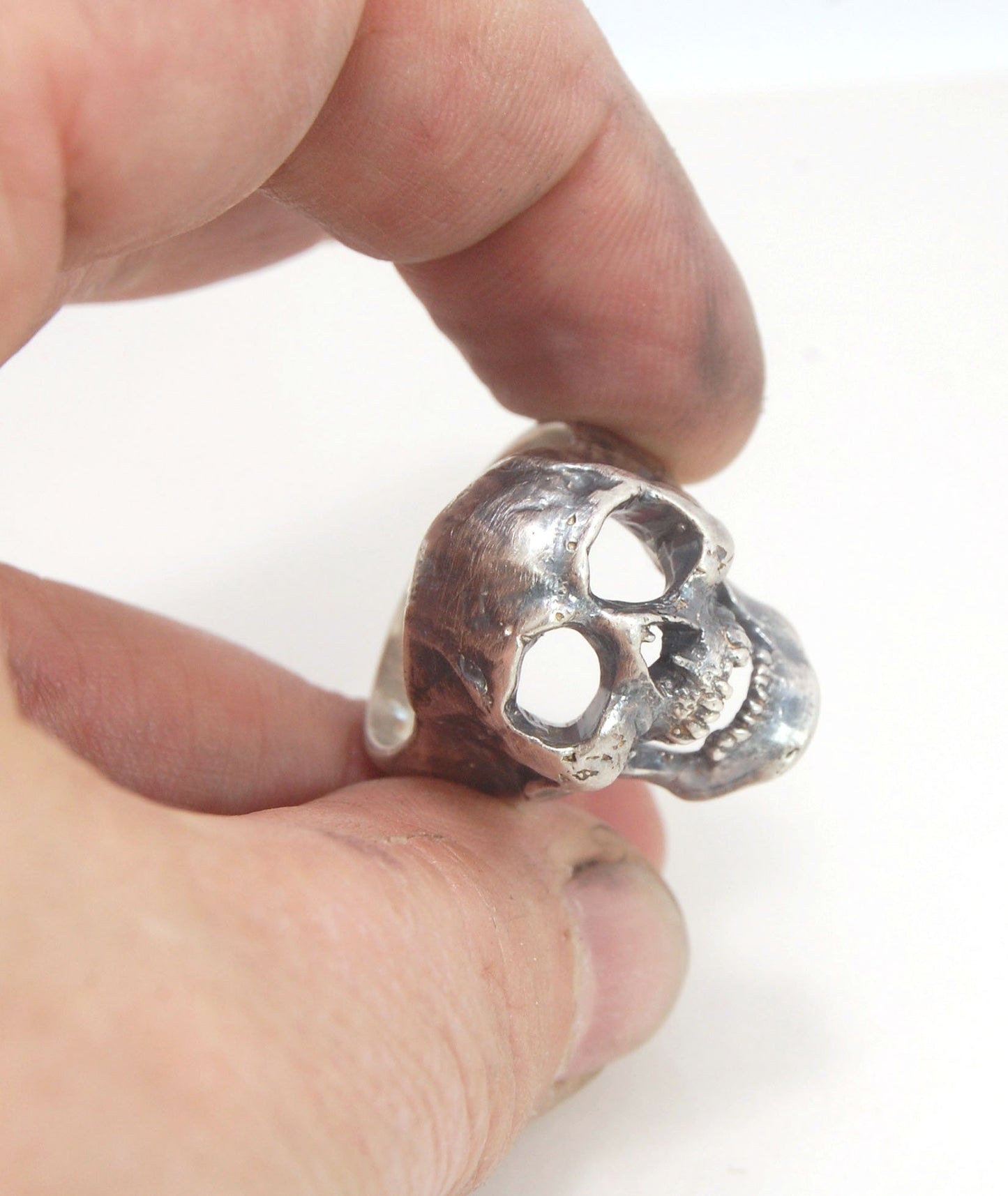 Screaming into the Void Skull Ring This is a lightweight but sizable skull ring that is Made to Order for you in your size. I carved this skull in wax, hollowed out the inside of the skull and cast it using the lost wax casting method. This Screaming into