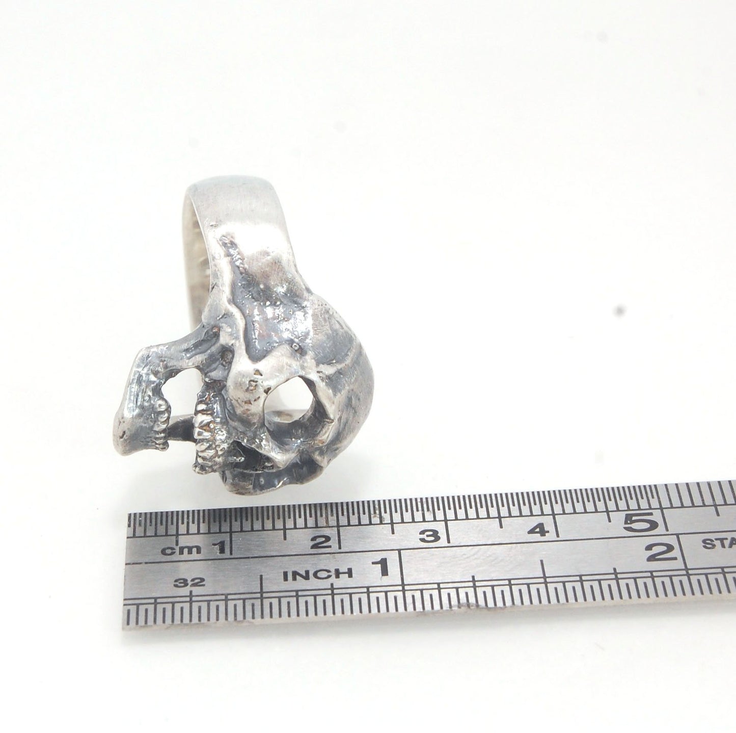 Screaming into the Void Skull Ring This is a lightweight but sizable skull ring that is Made to Order for you in your size. I carved this skull in wax, hollowed out the inside of the skull and cast it using the lost wax casting method. This Screaming into