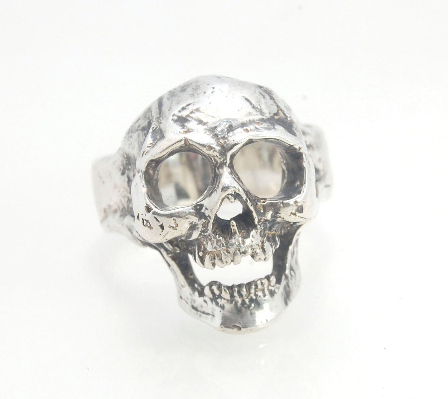 Screaming into the Void Skull Ring This is a lightweight but sizable skull ring that is Made to Order for you in your size. I carved this skull in wax, hollowed out the inside of the skull and cast it using the lost wax casting method. This Screaming into