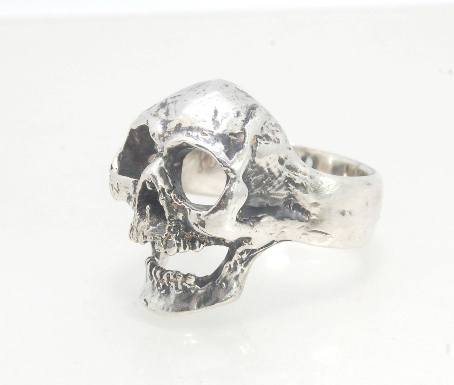 Screaming into the Void Skull Ring This is a lightweight but sizable skull ring that is Made to Order for you in your size. I carved this skull in wax, hollowed out the inside of the skull and cast it using the lost wax casting method. This Screaming into