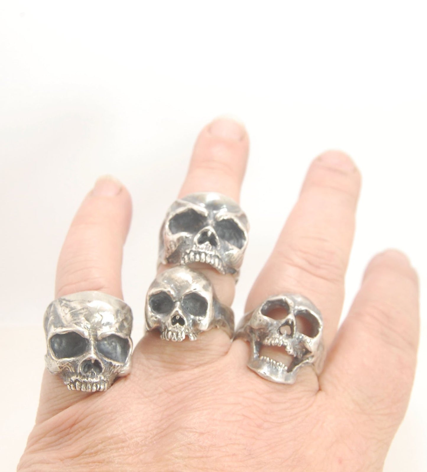 Screaming into the Void Skull Ring This is a lightweight but sizable skull ring that is Made to Order for you in your size. I carved this skull in wax, hollowed out the inside of the skull and cast it using the lost wax casting method. This Screaming into