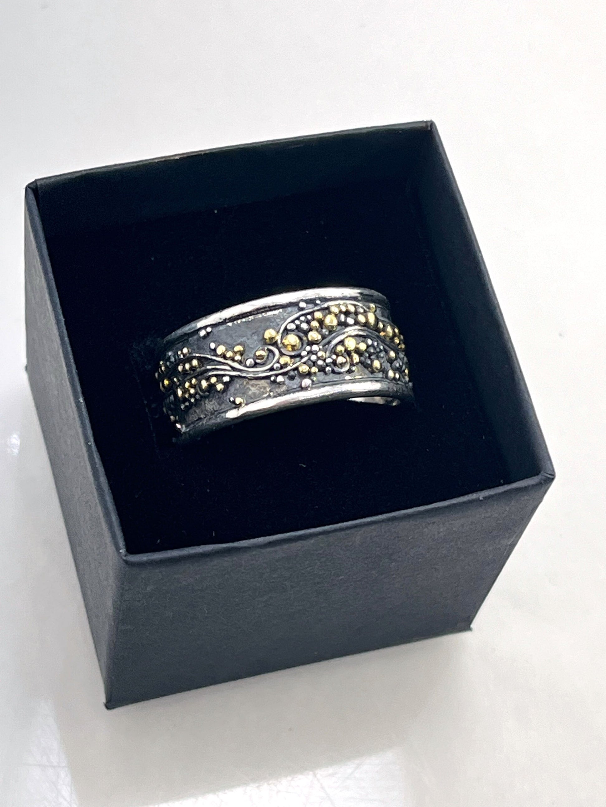 Cosmic Waves 18k and Fine Silver Granulation Ring 11mm wide This is very similar to the ring I made during the segment of “A Craftsman’s Legacy” on PBS a few years ago but with 18k gold granules of varying sizes. I am happy to make one for you in your siz