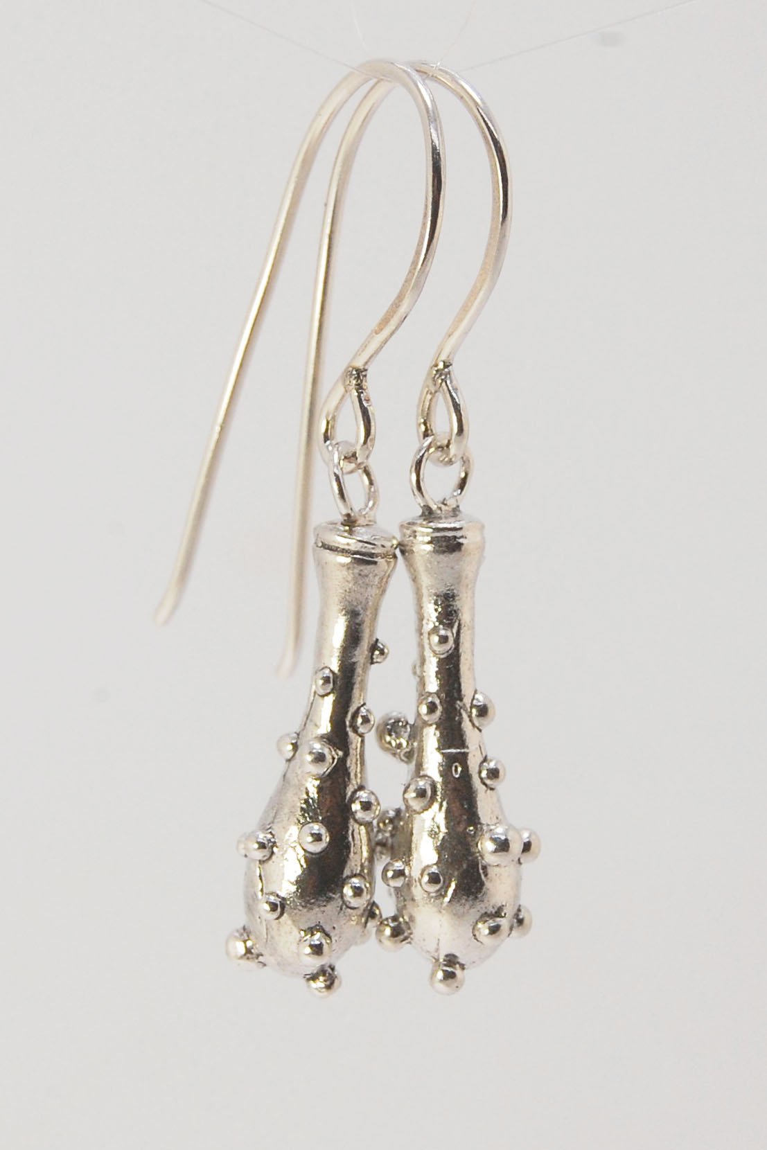 Bubble Club Dangle Earrings in Sterling These fun dangle earrings started as an experiment in wax that I ended up just LOVING!Here they are in Sterling after being cast using the ancient lost wax process. I then made a mold so I can make as many as I want