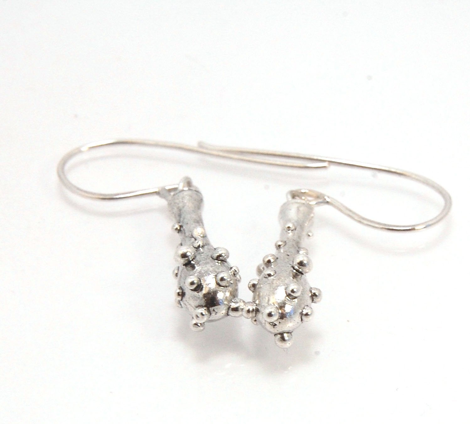 Bubble Club Dangle Earrings in Sterling These fun dangle earrings started as an experiment in wax that I ended up just LOVING!Here they are in Sterling after being cast using the ancient lost wax process. I then made a mold so I can make as many as I want