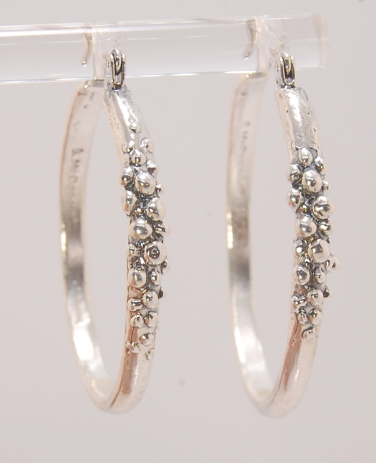 Bubble Hoops in Sterling These are great, unusual sterling silver bubble hoops. Carved in Wax and Cast in sterling silver with a lost wax process in my studio, these bubble beauties have a nice weight and the ear wire and clasp have a satisfying click. Da