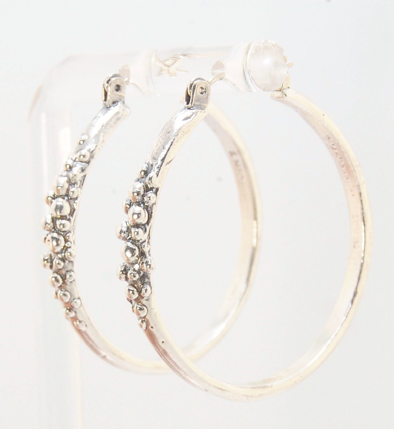 Bubble Hoops in Sterling These are great, unusual sterling silver bubble hoops. Carved in Wax and Cast in sterling silver with a lost wax process in my studio, these bubble beauties have a nice weight and the ear wire and clasp have a satisfying click. Da