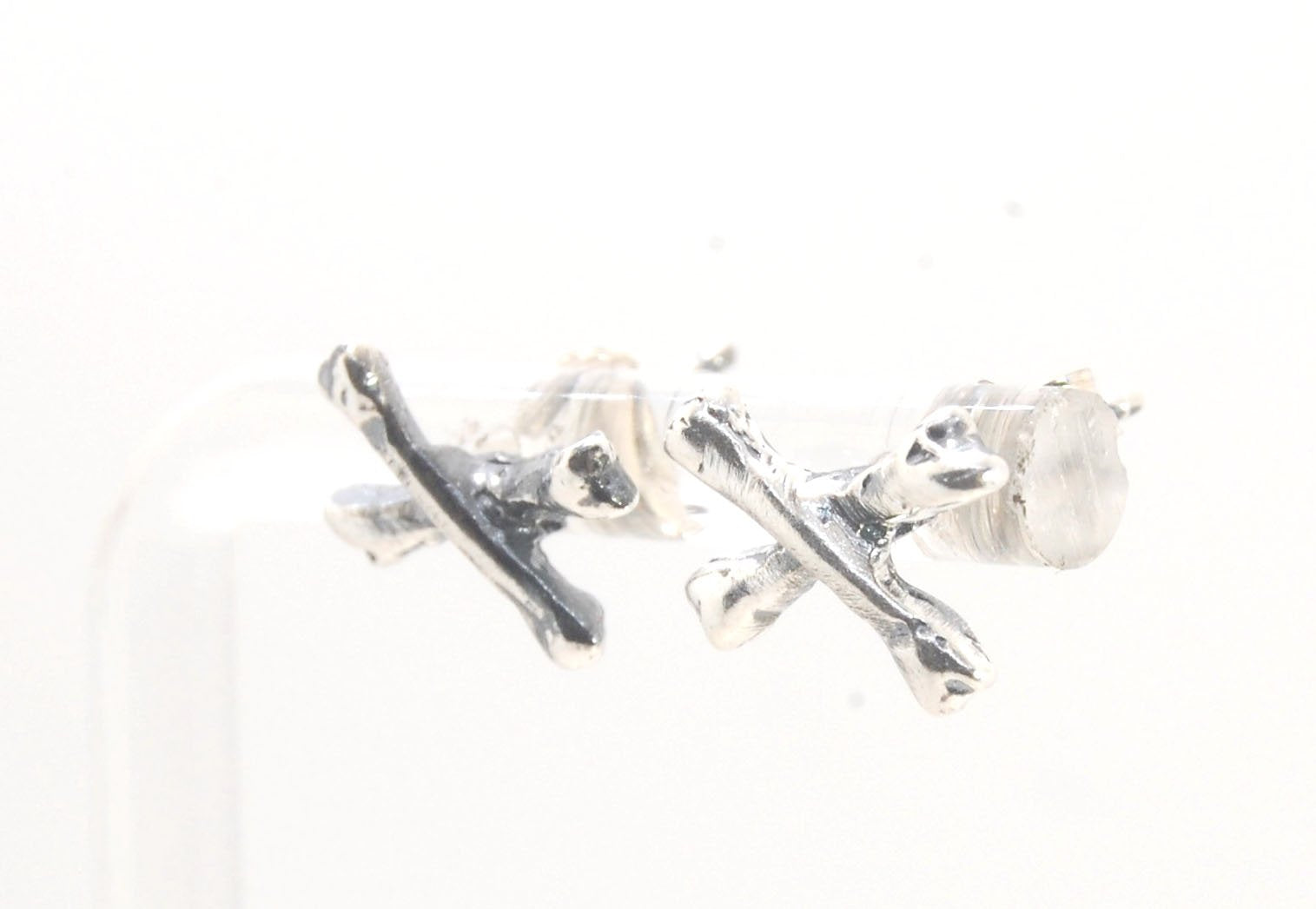 Crossbones Studs These solid sterling silver Crossbones Studs are wax carved by hand and cast using the ancient process of Lost Wax to cast them in sterling silver. I then made a mold, which I can inject with wax and make wax copies of the Crossbones and