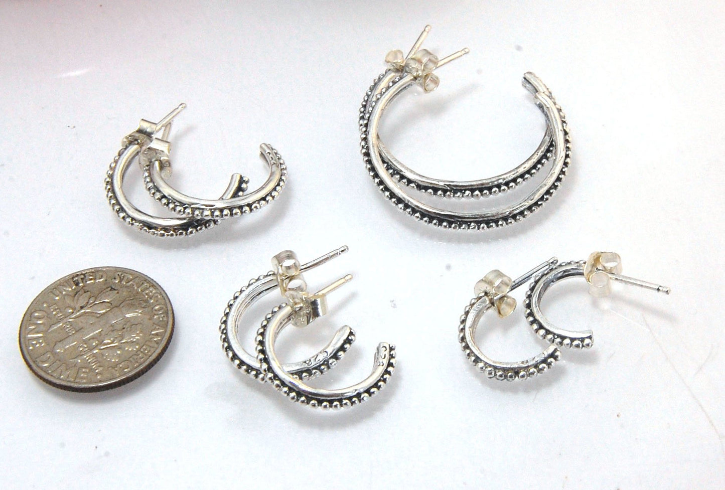 Etruscan Hoop Posts - Medium - Sterling Silver These are my Medium sized Etruscan Hoops as a post-earring!These sterling silver hoop posts are cast using the Lost Wax process from a granulated master for a limited edition series of hoops. I use fine silve