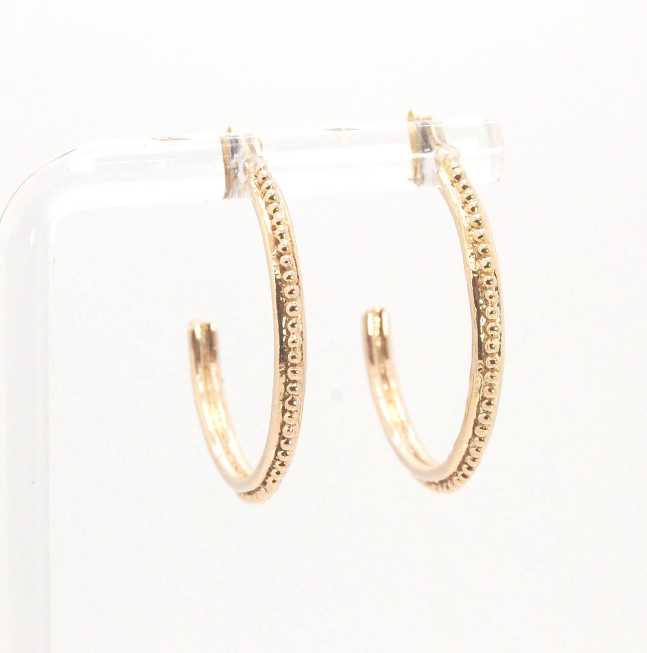 Etruscan hoop posts in 14k Gold - Large These Etruscan Hoop Posts in 14k yellow gold hoops are cast in my studio (actually on the deck as casting needs good ventilation) from a granulated master for a limited edition series of hoops. I use fine silver for