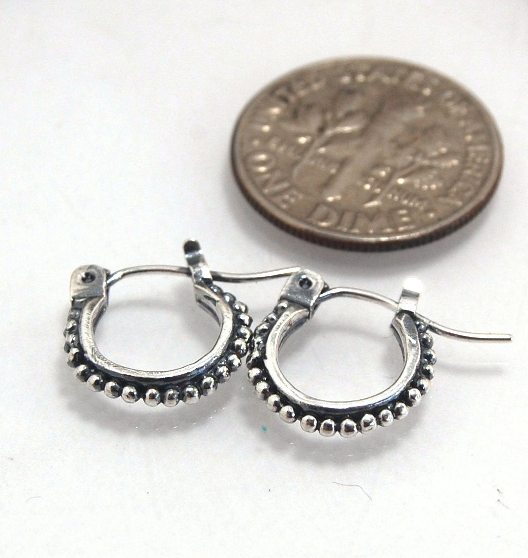 Etruscan hoops in Sterling Silver - xtraSmall Huggies These xtra small huggie hoops in sterling silver hoops are cast from a granulated master for a limited edition series of hoops and graze the bottom of your earlobe. I use fine silver for the original g