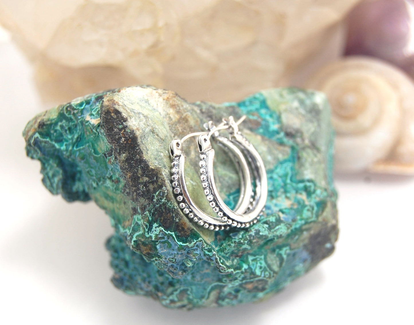 Etruscan hoops in Sterling Silver - Medium These sterling silver hoops are cast in my studio from a granulated master for a limited edition series of cast, granulated hoops. I use fine silver for the original granulation, then make a mold, pull a wax copy