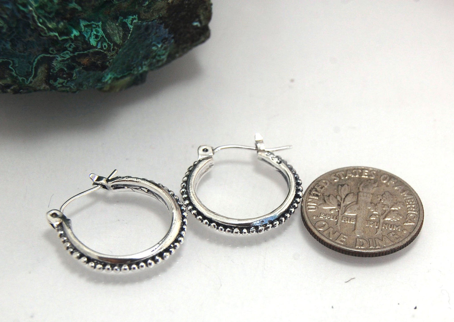Etruscan hoops in Sterling Silver - Medium These sterling silver hoops are cast in my studio from a granulated master for a limited edition series of cast, granulated hoops. I use fine silver for the original granulation, then make a mold, pull a wax copy