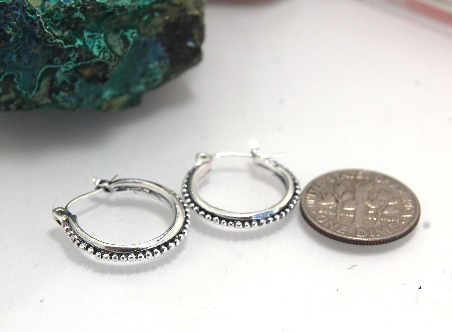 Etruscan hoops in Sterling Silver - Medium These sterling silver hoops are cast in my studio from a granulated master for a limited edition series of cast, granulated hoops. I use fine silver for the original granulation, then make a mold, pull a wax copy