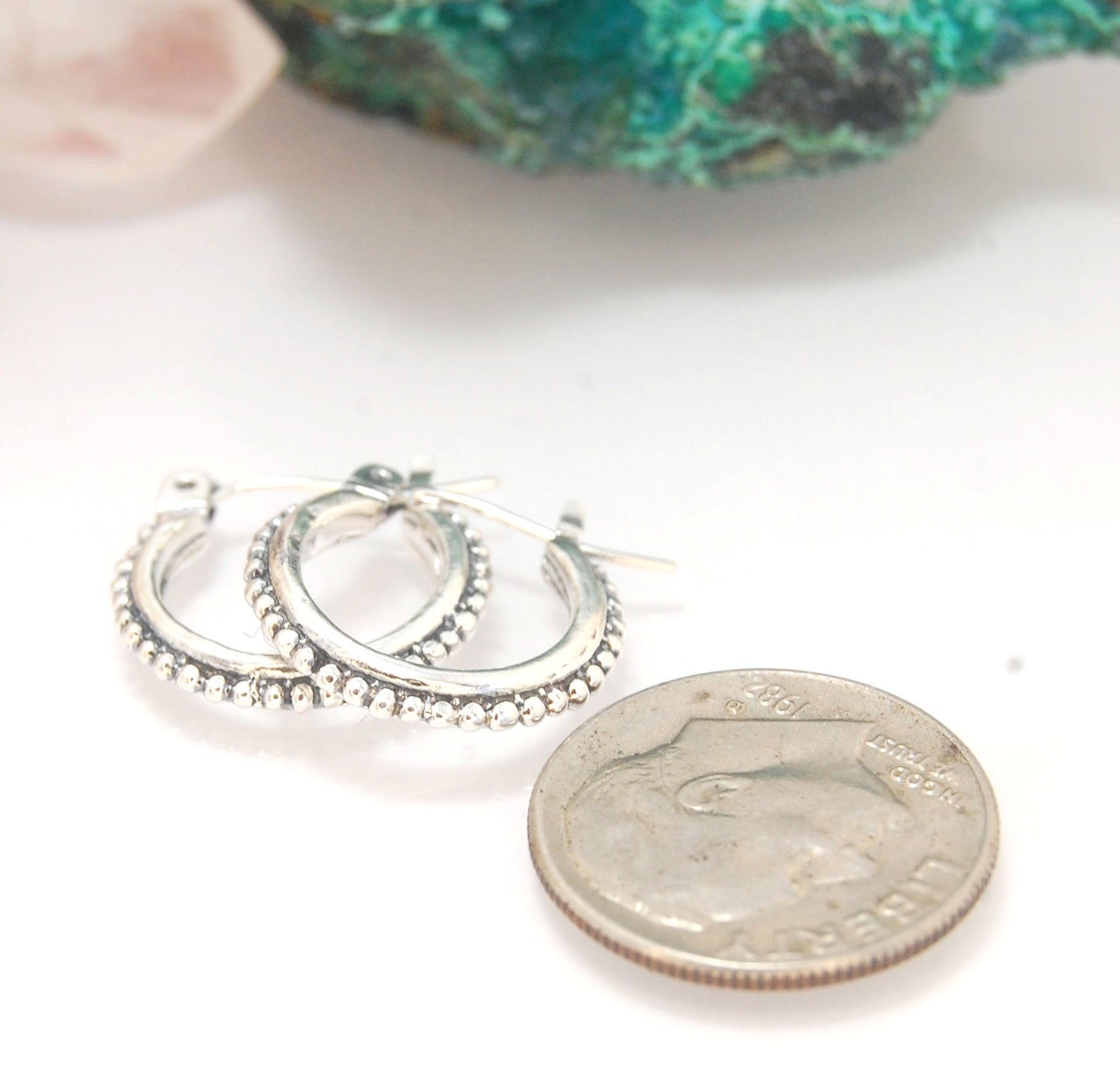 Etruscan hoops in Sterling Silver - Small These sterling silver hoops are cast in my studio (actually on the deck as casting needs good ventilation) from a granulated master for a limited edition series of hoops. I use fine silver for the original granula