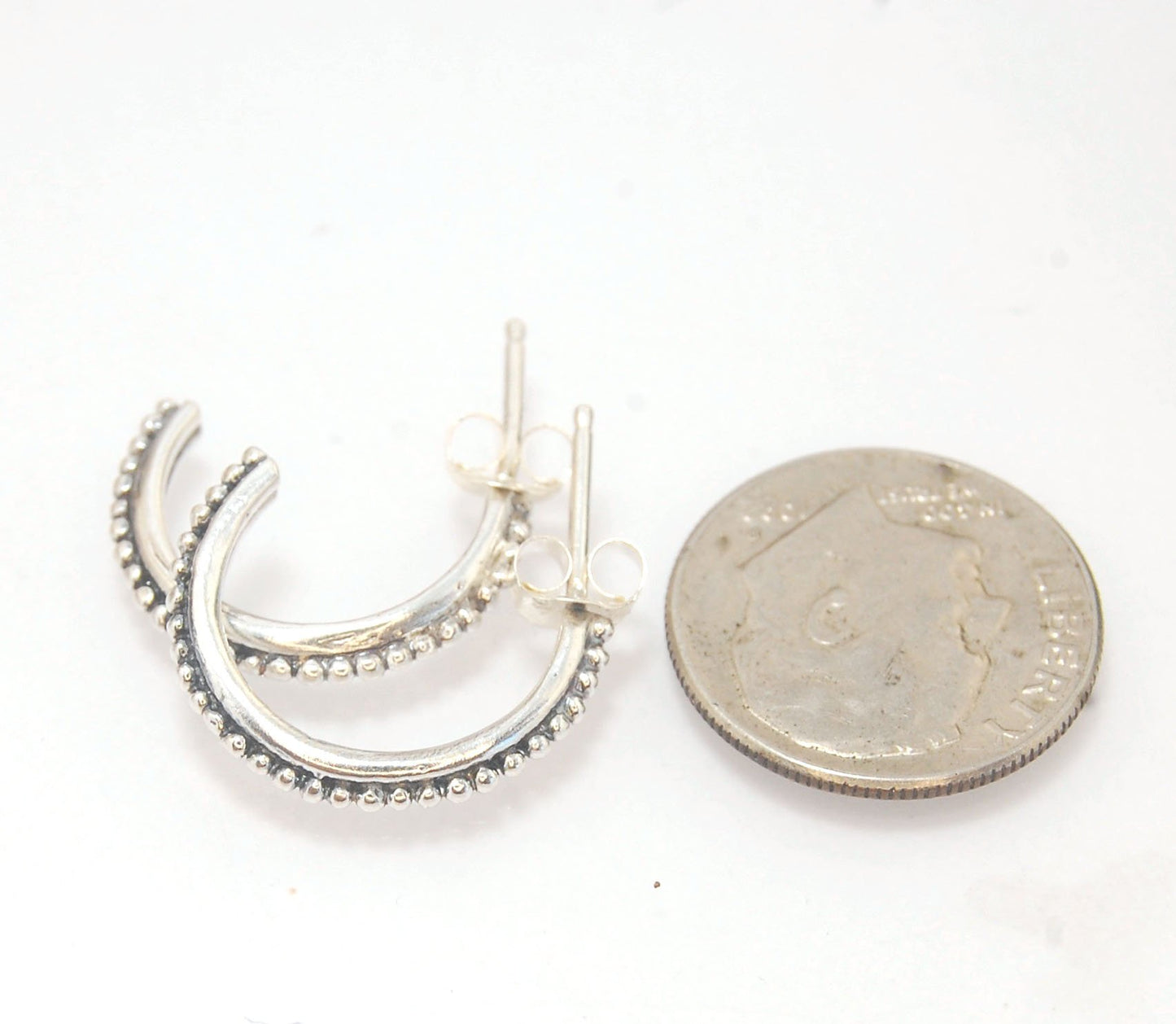 Etruscan Hoop Posts - Small in Sterling Silver and 14k gold These are my second smallest Etruscan Hoops as a post earring! Smaller than a dime - these post hoops hug your earlobe. So freakin’ cute! I like to wear them in my second piercing up. But y'all d