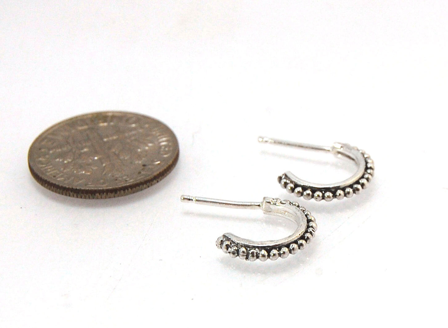 Etruscan Hoop Posts - Xtra Small in Sterling Silver These are my smallest Etruscan Hoops as a post-earring! Smaller than a dime - these post hoops hug your earlobe. So freakin’ cute! I like to wear them in my second piercing up and I prefer the gold! But